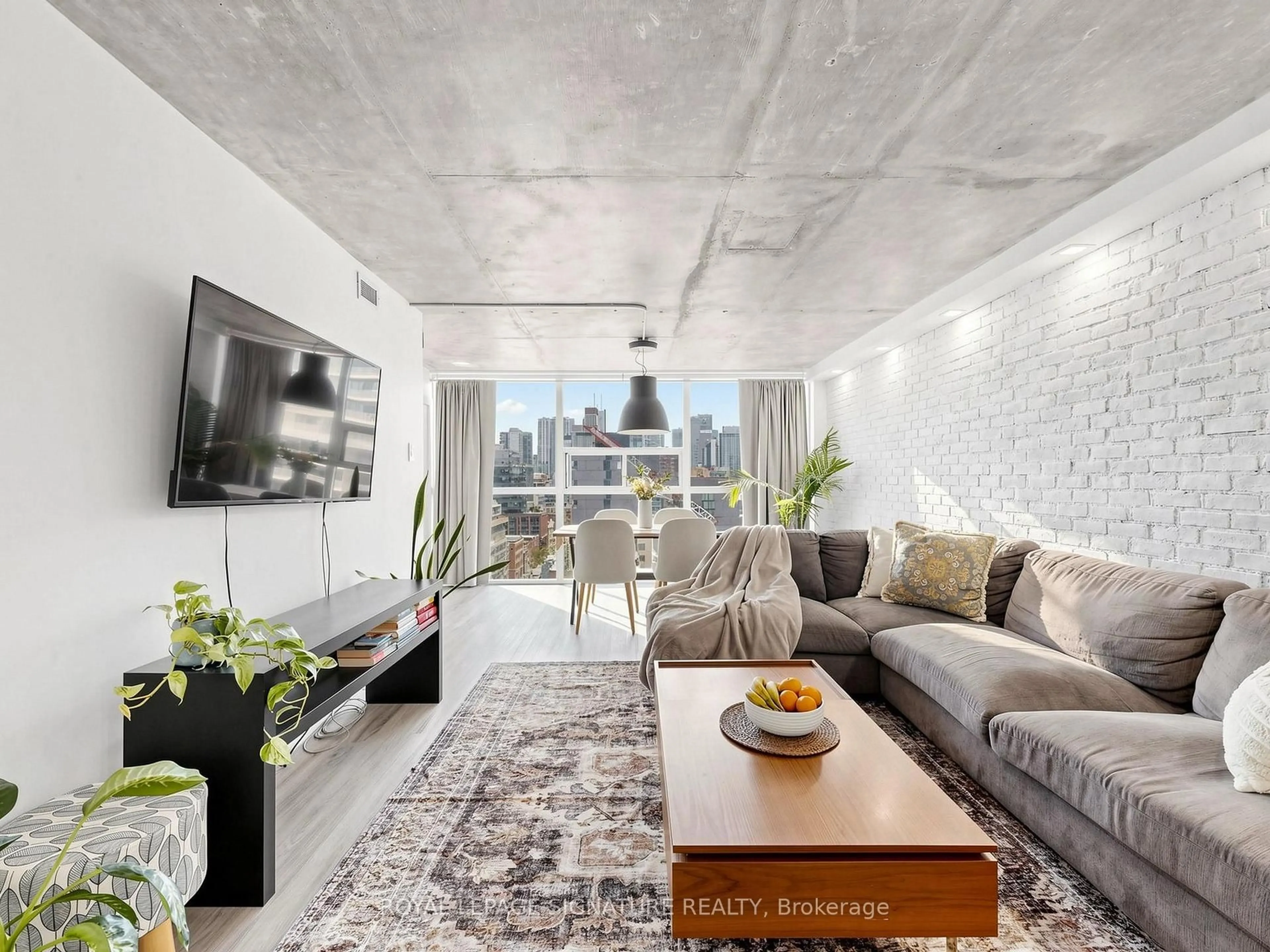 Living room with furniture, cement floor for 705 King St #1603, Toronto Ontario M5V 2W8