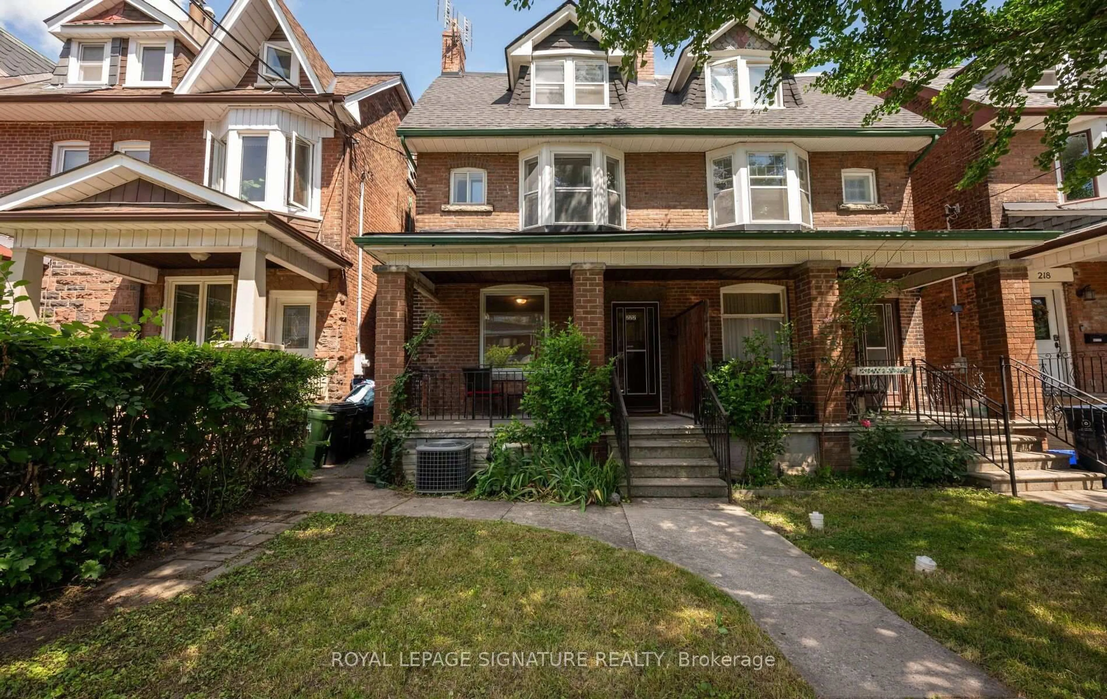 Home with brick exterior material, street for 222 Melita Ave, Toronto Ontario M6G 2A2