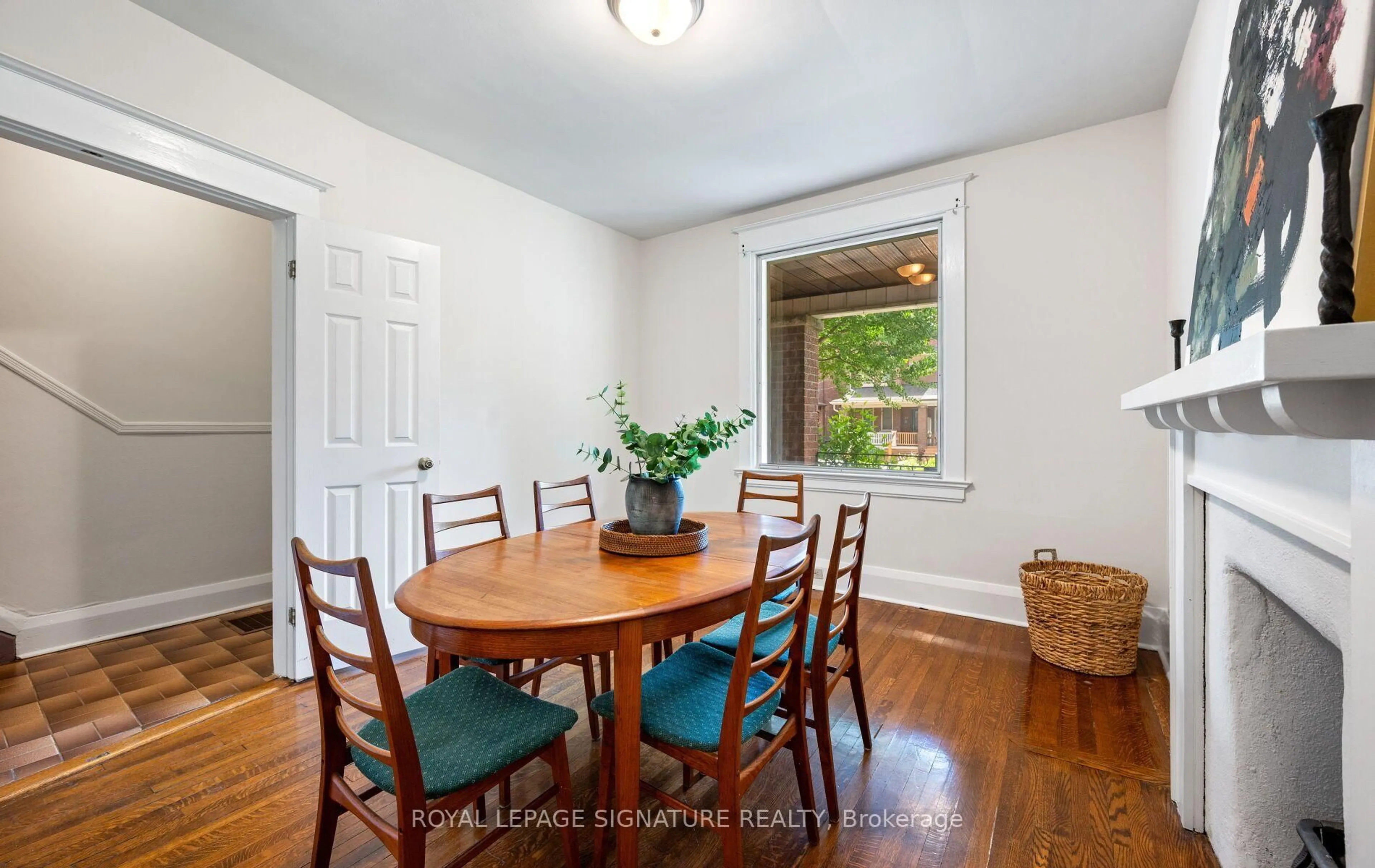 Dining room, wood/laminate floor for 222 Melita Ave, Toronto Ontario M6G 2A2