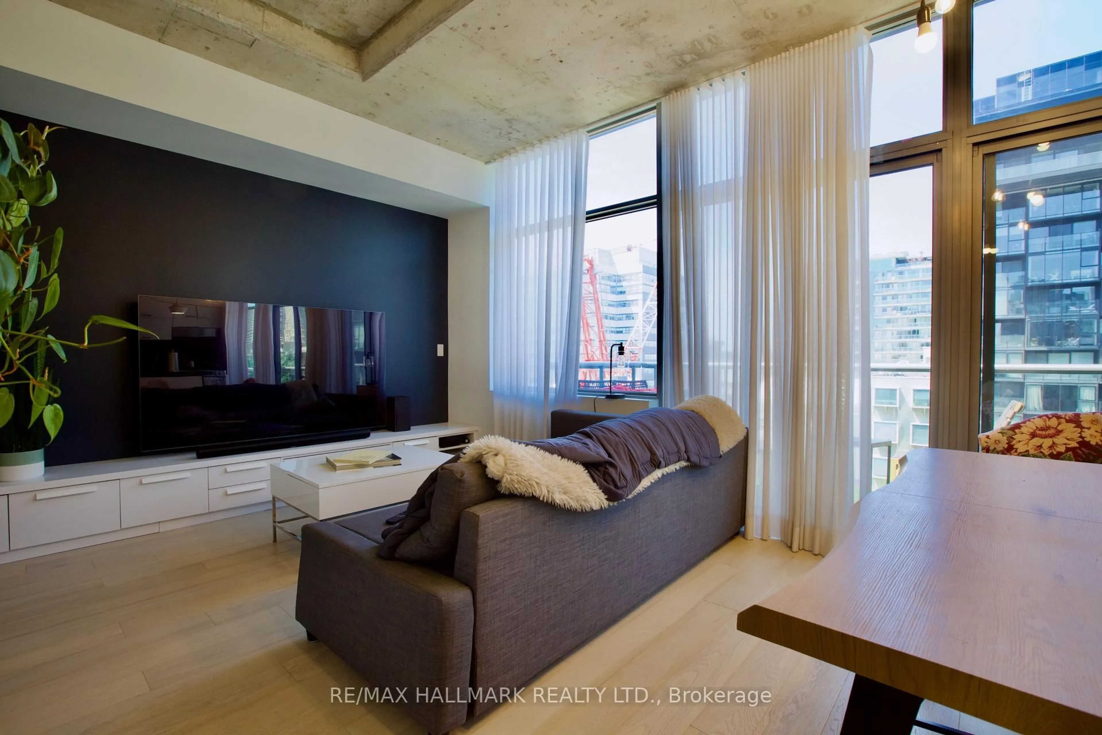 Living room with furniture, cement floor for 55 Stewart St #1010, Toronto Ontario M5V 2V1