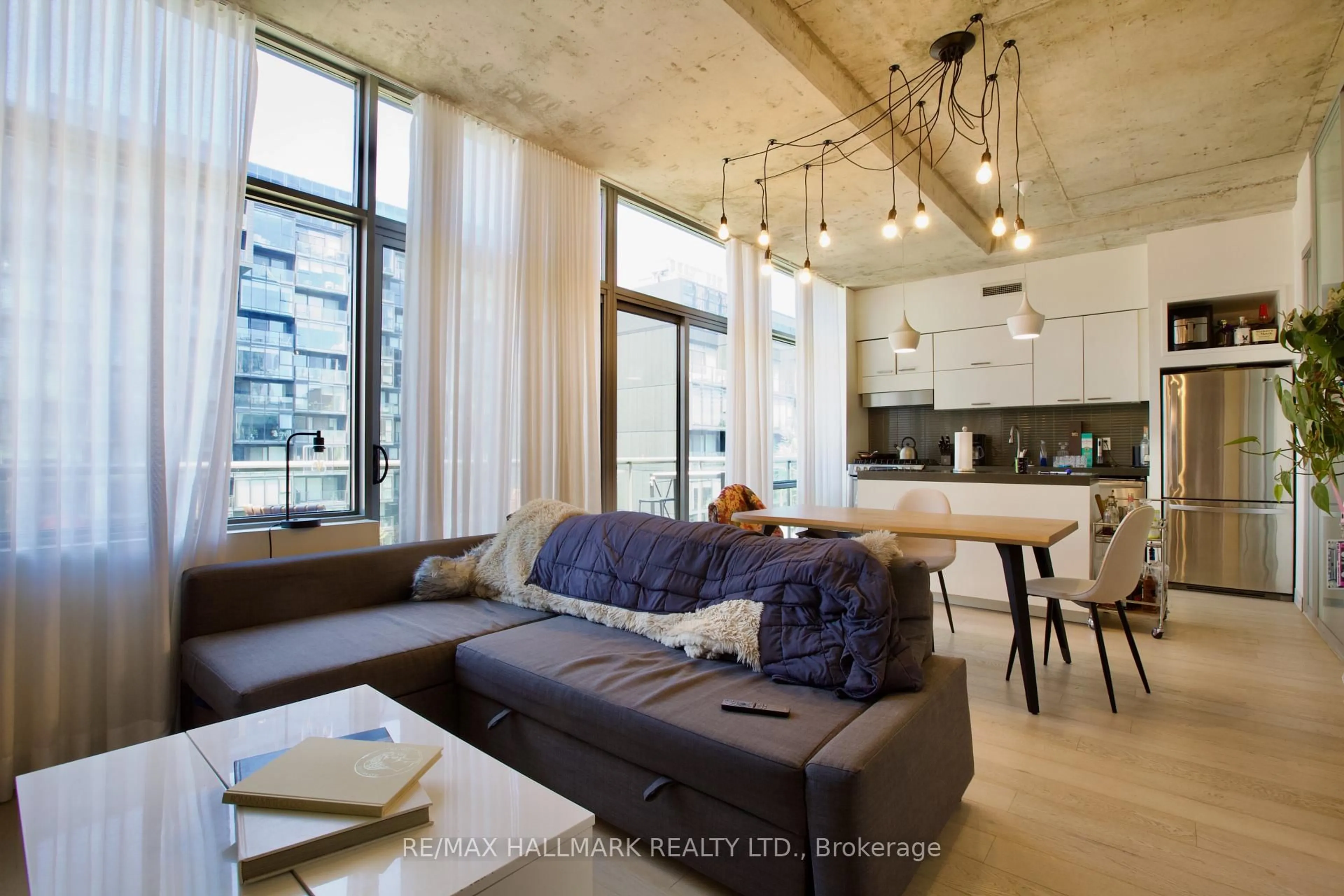 Living room with furniture, cement floor for 55 Stewart St #1010, Toronto Ontario M5V 2V1