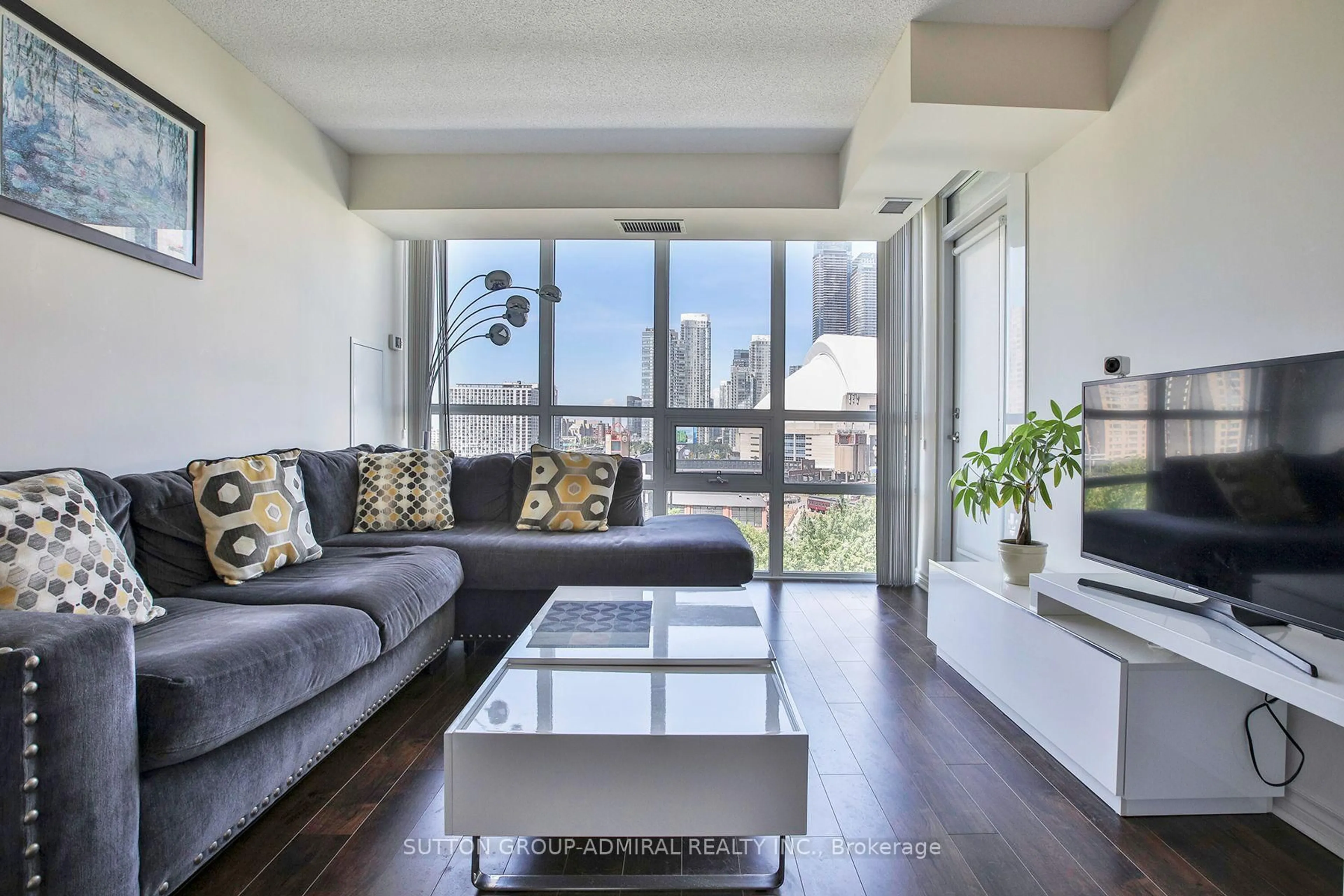 Living room with furniture, wood/laminate floor for 25 Lower Simcoe St #1017, Toronto Ontario M5J 3A1