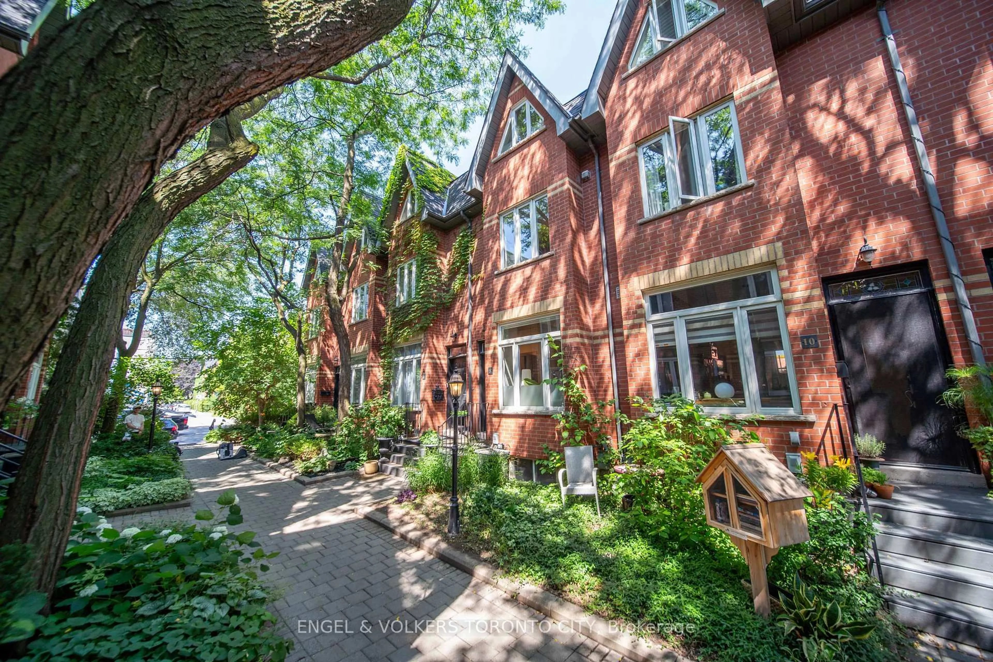 Home with brick exterior material, street for 8 Old Trillium Lane, Toronto Ontario M5A 4T2