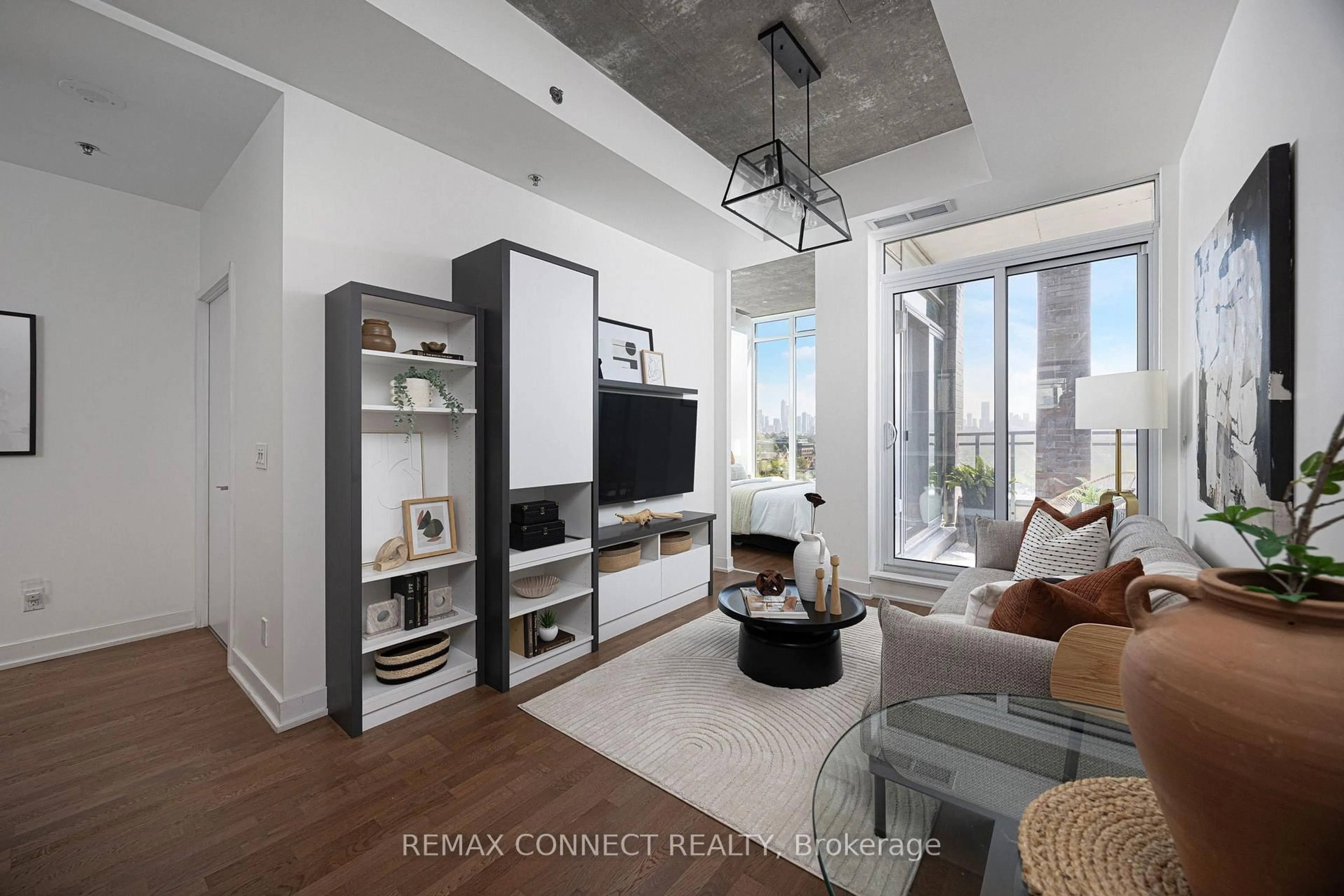 Living room with furniture, cement floor for 20 Minowan Miikan Lane #1127, Toronto Ontario M6J 0E5