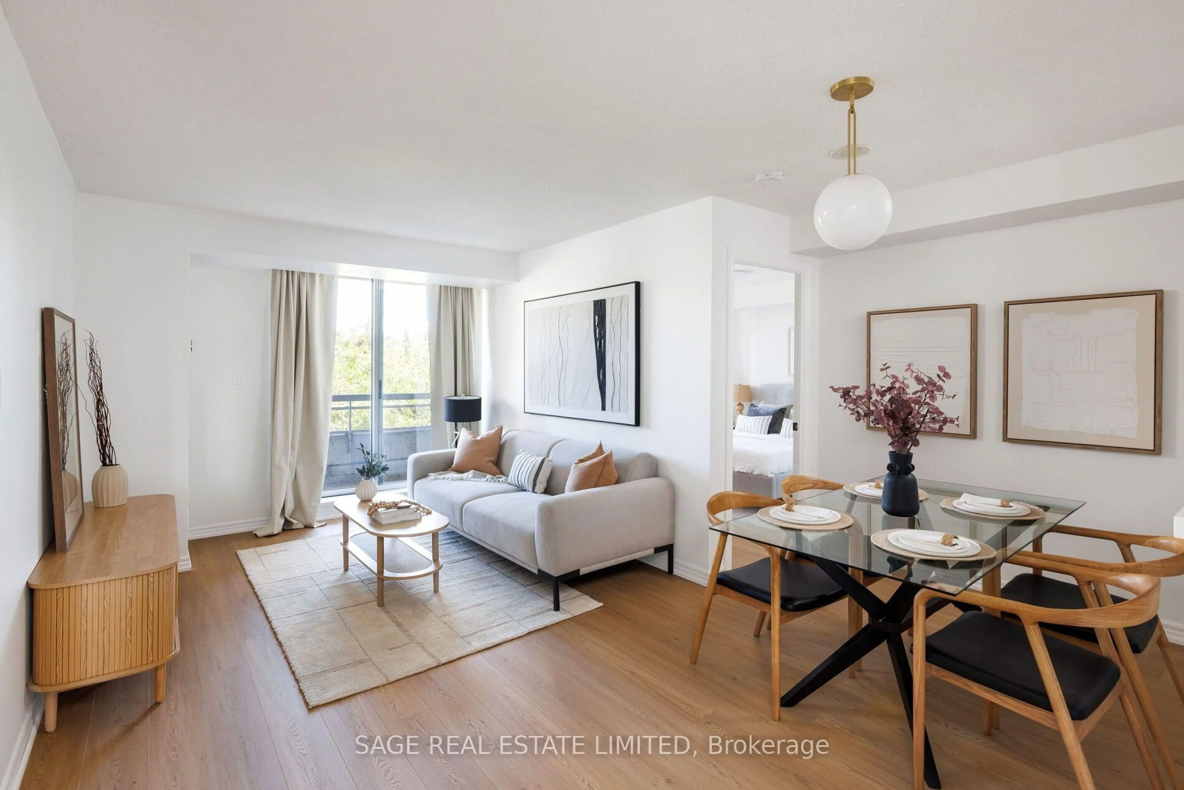Living room with furniture, wood/laminate floor for 1700 Eglinton Ave #205, Toronto Ontario M4A 2X4
