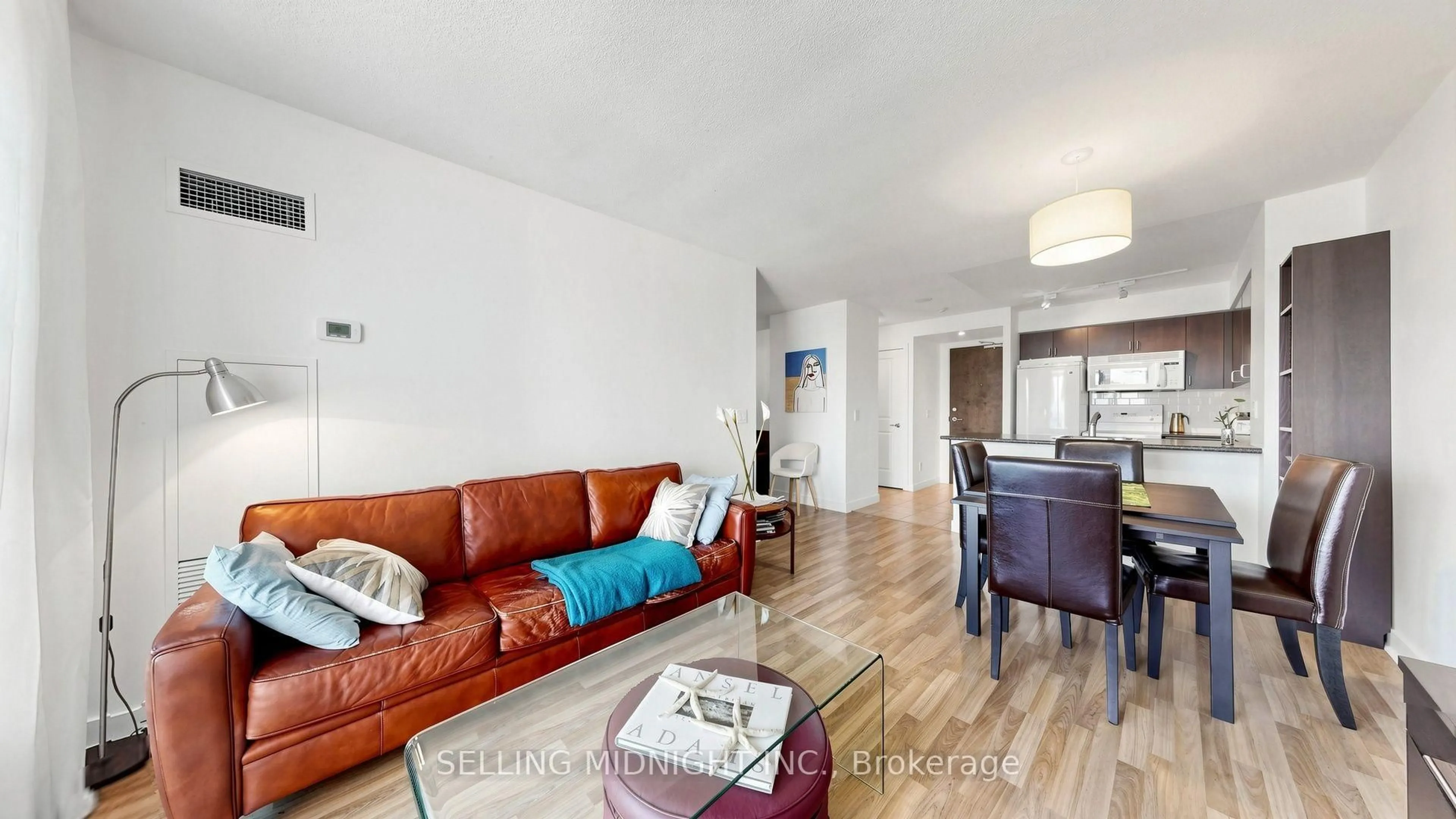 Living room with furniture, wood/laminate floor for 50 Lynn Williams St #1010, Toronto Ontario M6K 3R9
