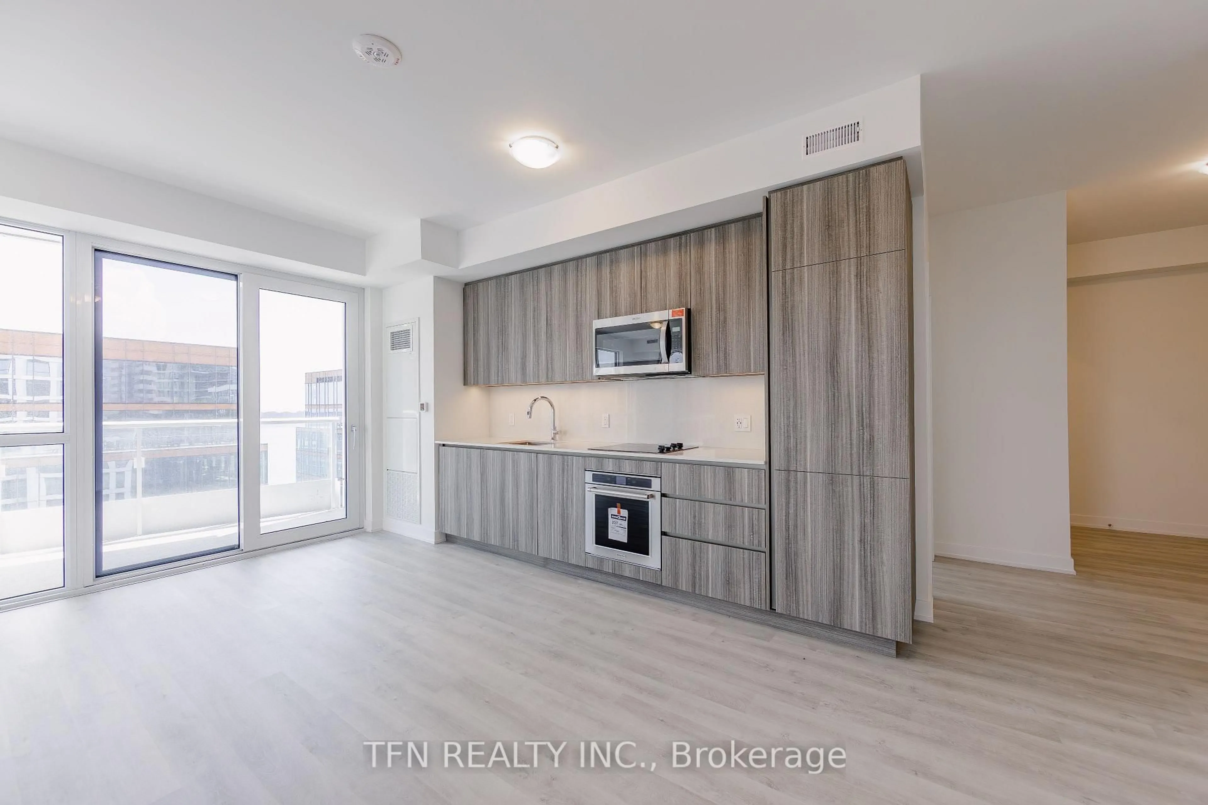 Open concept kitchen, wood/laminate floor for 15 Richardson St #1313, Toronto Ontario M5A 0Y5