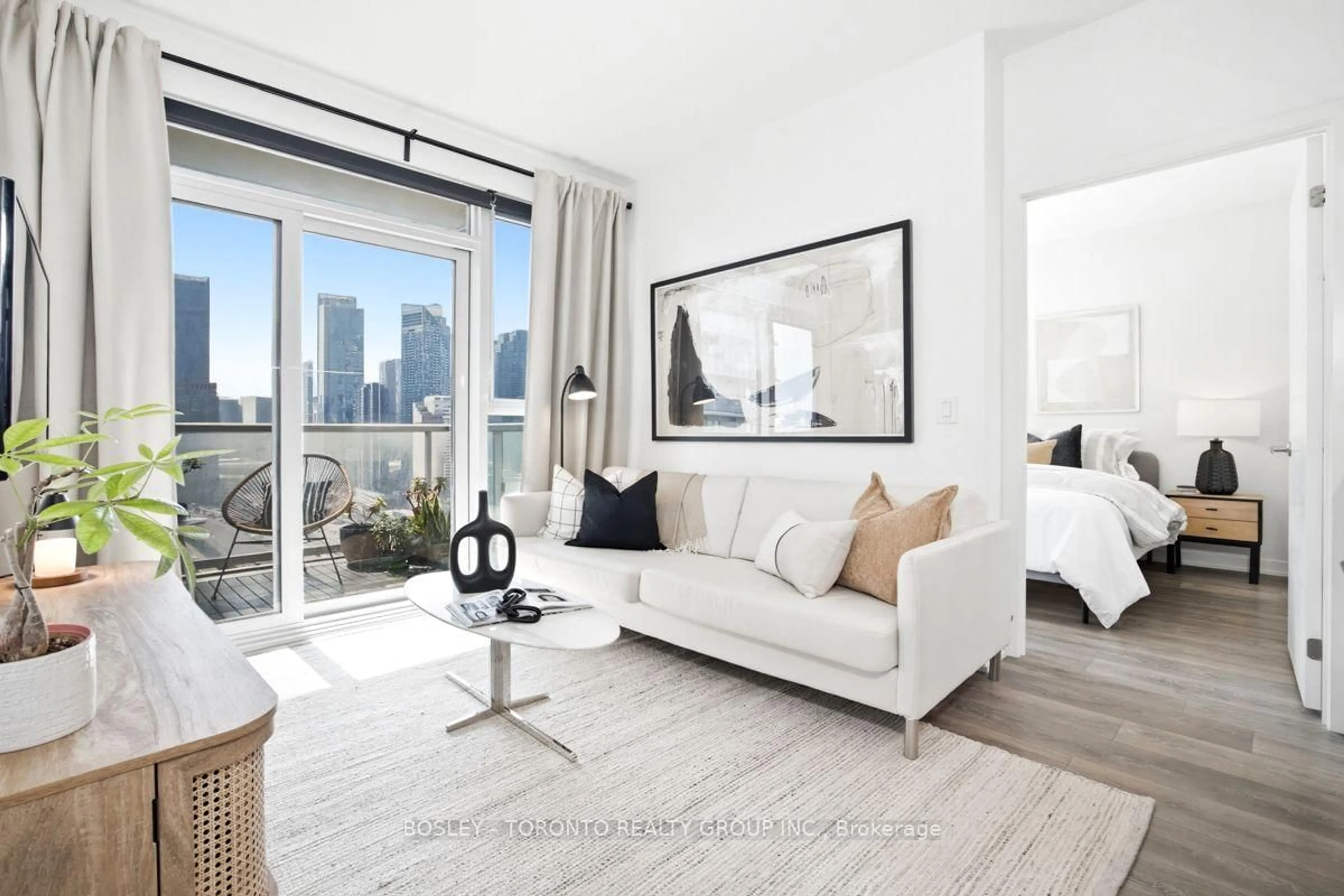 Living room with furniture, wood/laminate floor for 20 Richardson St #2007, Toronto Ontario M5A 0S6