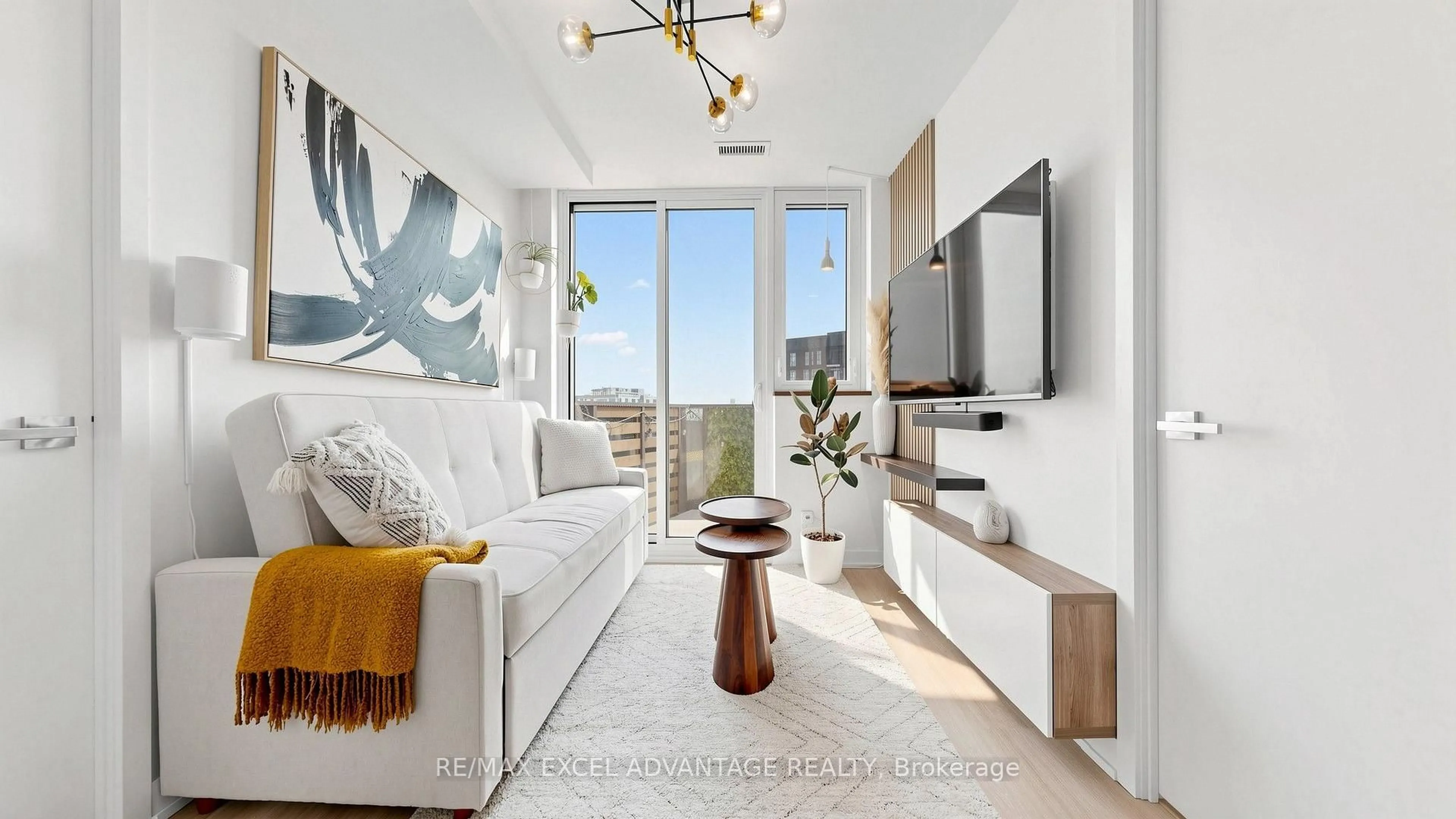 Living room with furniture, wood/laminate floor for 30 Tretti Way #PH17, Toronto Ontario M3H 0E3