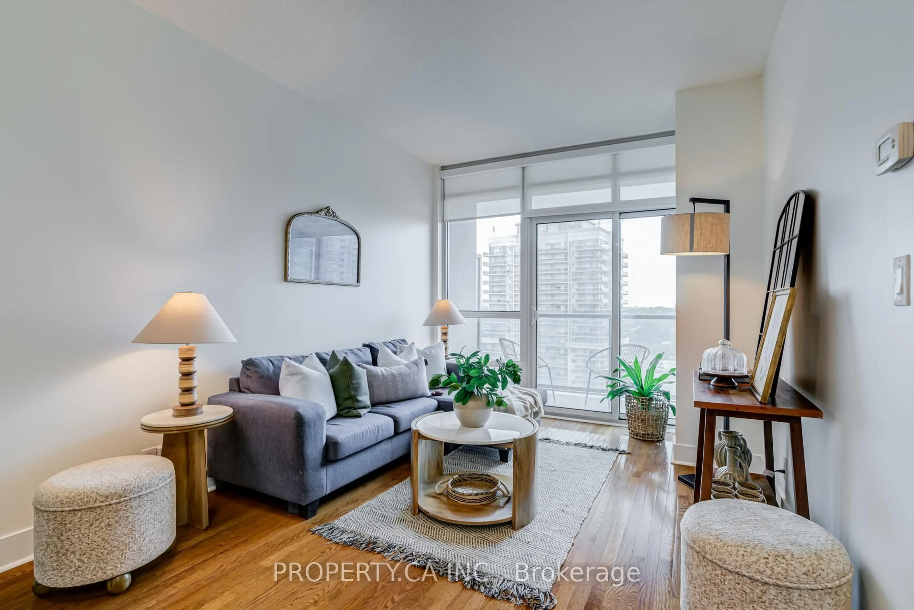 Living room with furniture, wood/laminate floor for 26 Norton Ave #1111, Toronto Ontario M2N 0C6