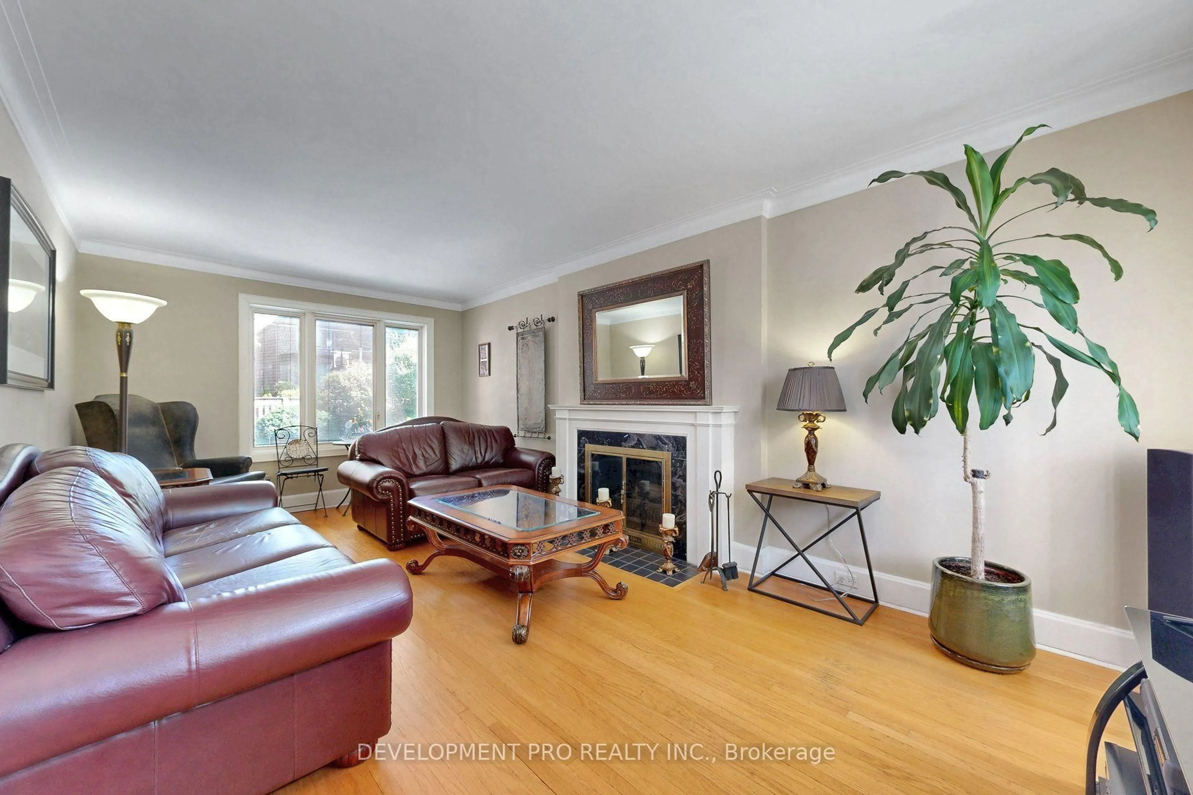 Living room with furniture, wood/laminate floor for 534 Deloraine Ave, Toronto Ontario M5M 2C3
