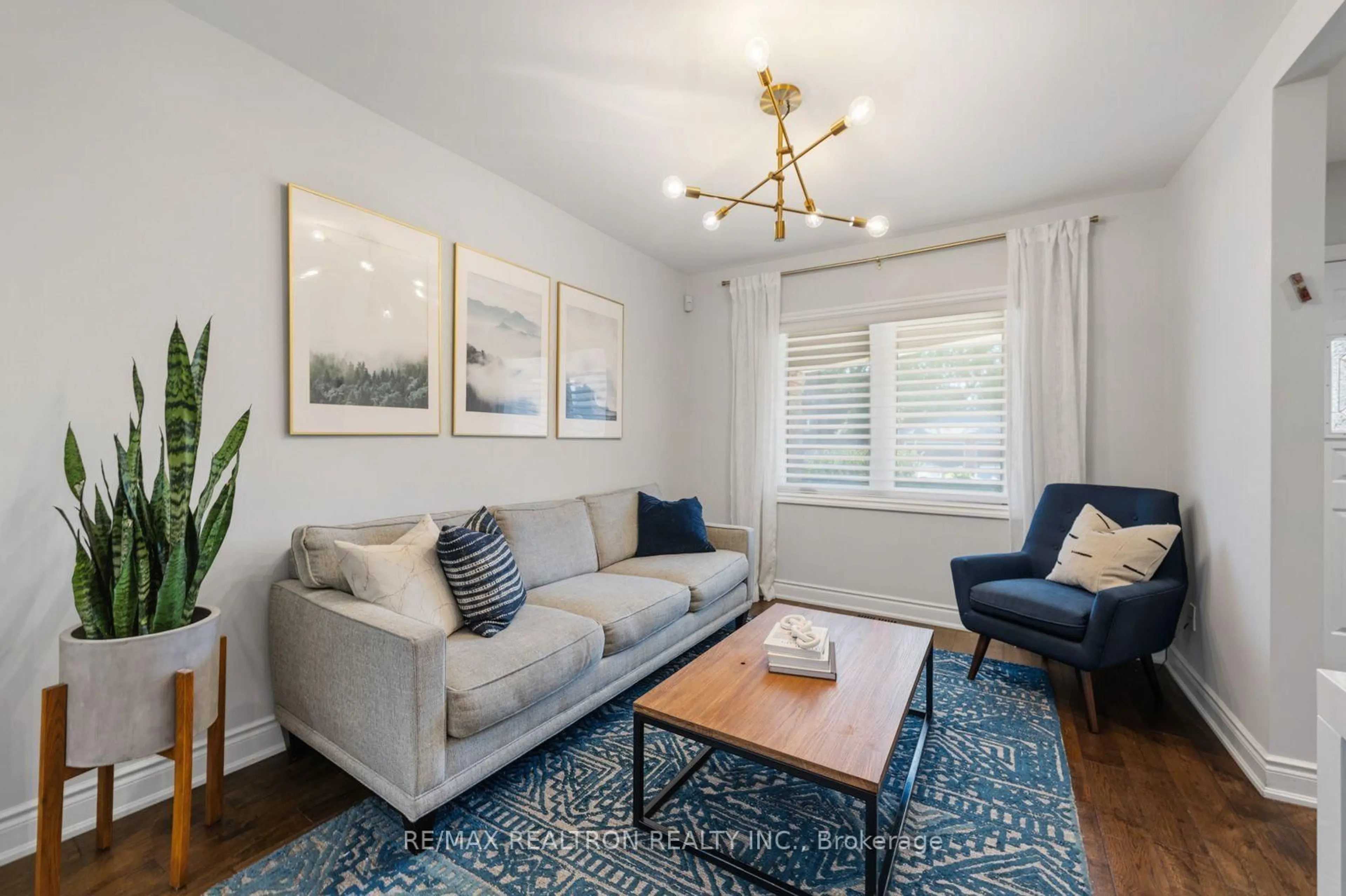 Living room with furniture, wood/laminate floor for 4 Normanna Ave, Toronto Ontario M6C 1H2