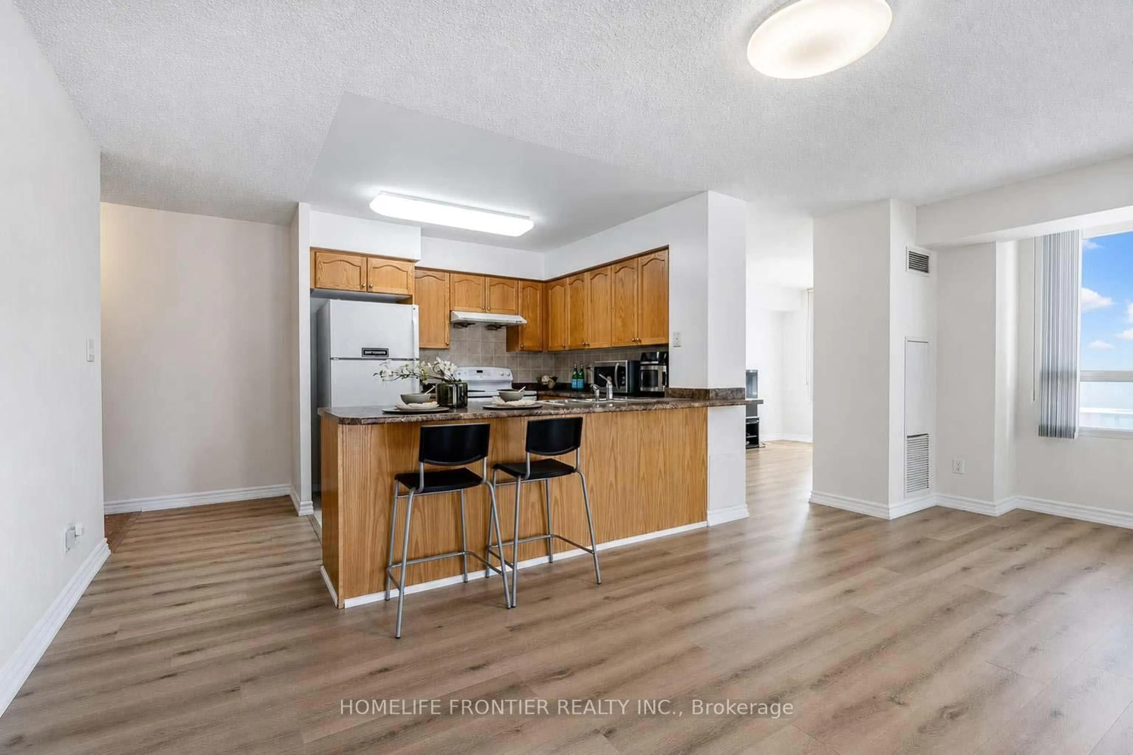 Open concept kitchen, wood/laminate floor for 18 Spring Garden Ave #310, Toronto Ontario M2N 7M2