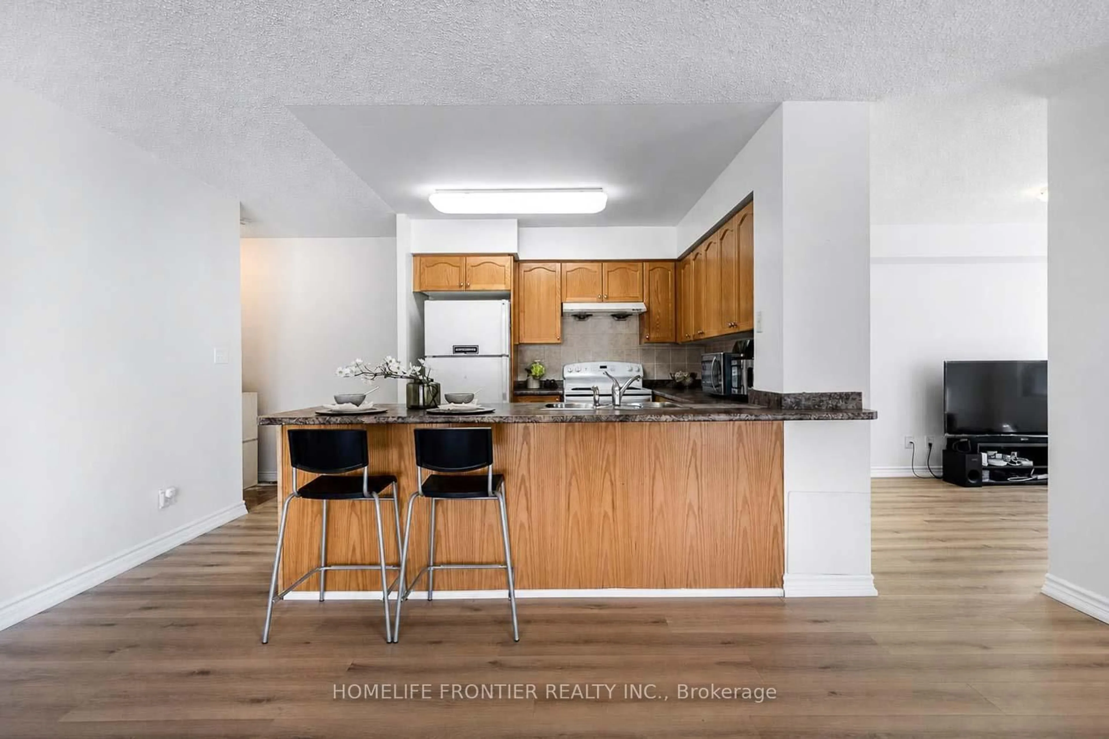 Open concept kitchen, wood/laminate floor for 18 Spring Garden Ave #310, Toronto Ontario M2N 7M2