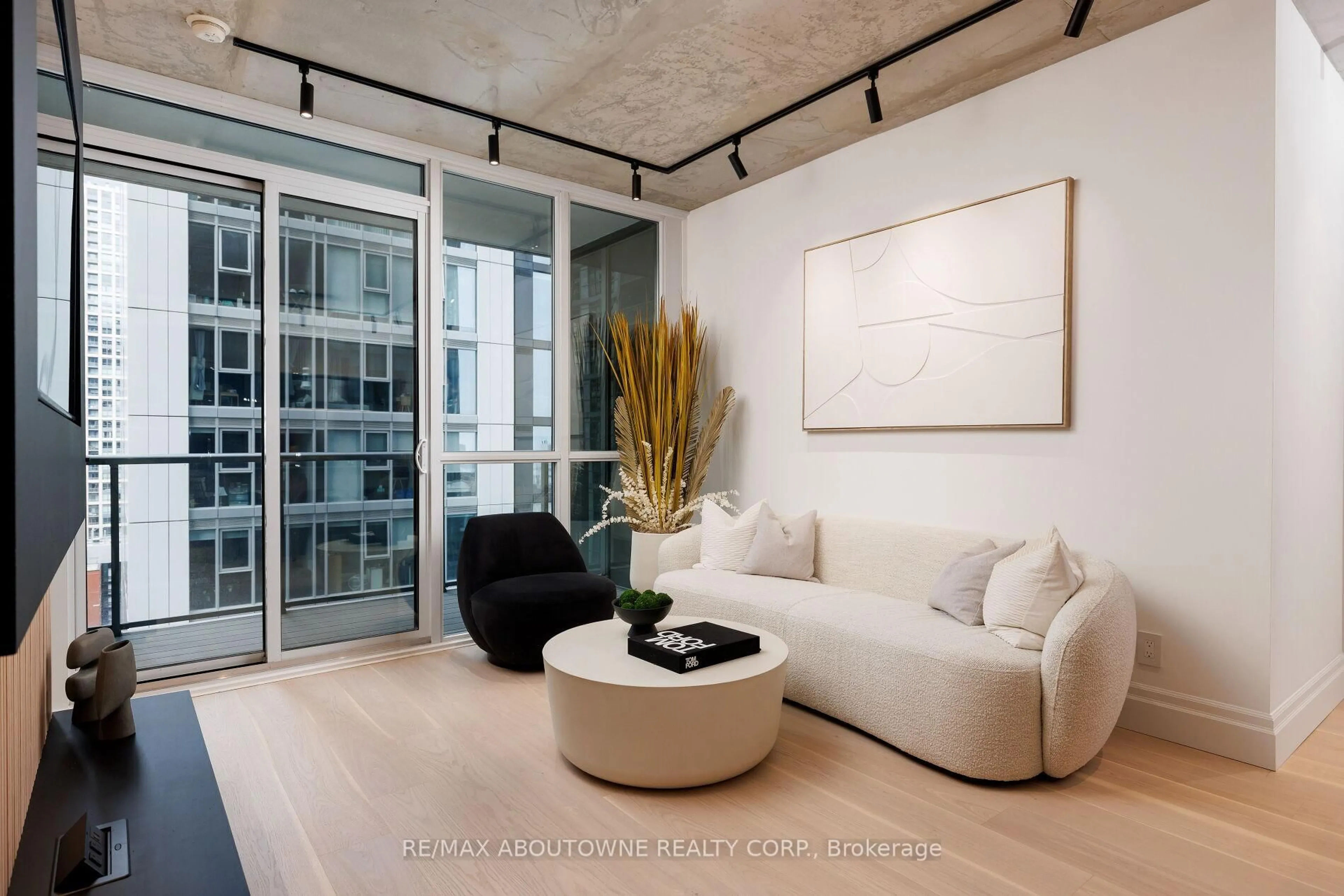 Living room with furniture, cement floor for 88 Blue Jays Way #2301, Toronto Ontario M5V 0L7