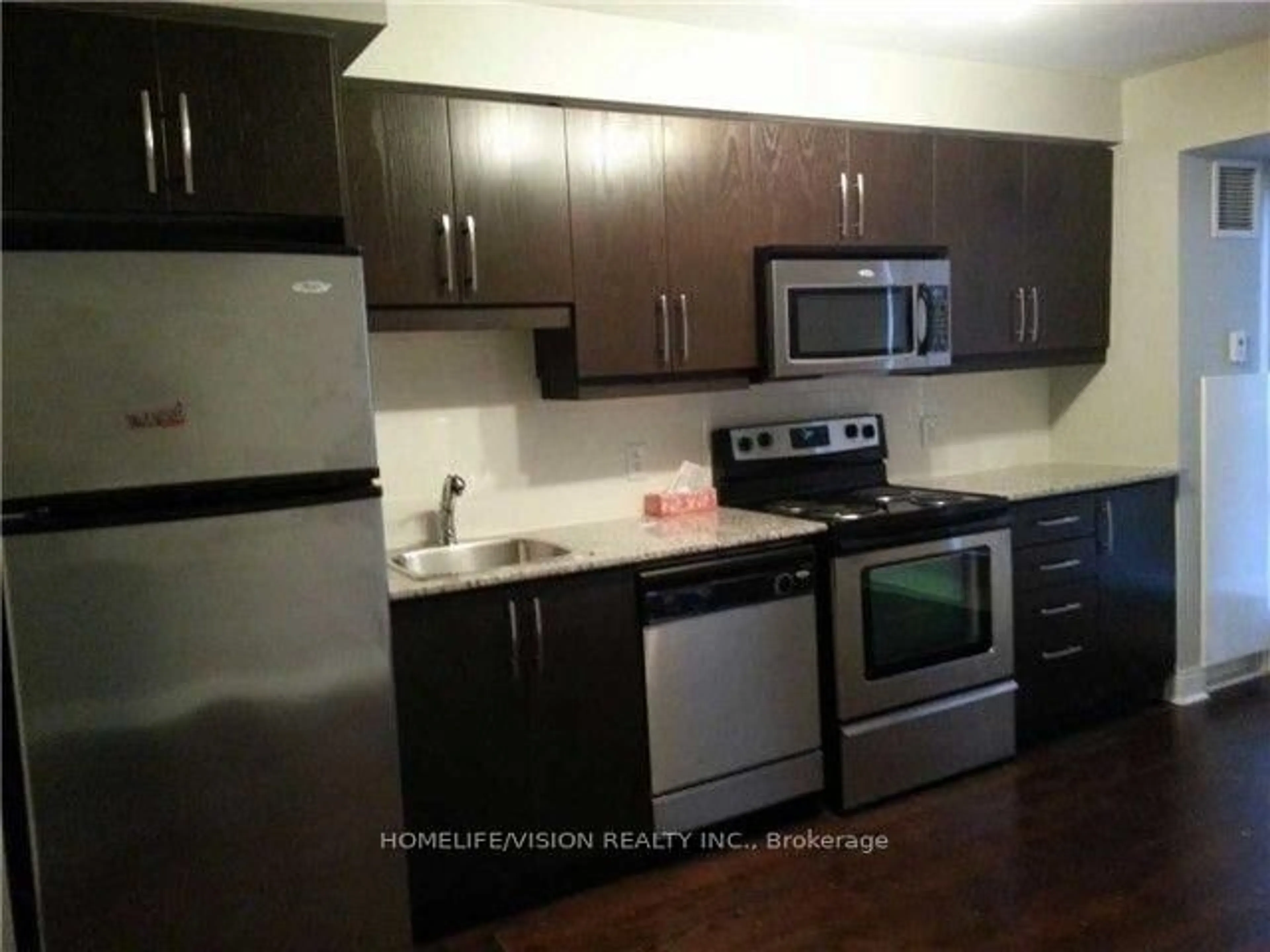 Standard kitchen, wood/laminate floor for 1 Scott St #610, Toronto Ontario M5E 1A1