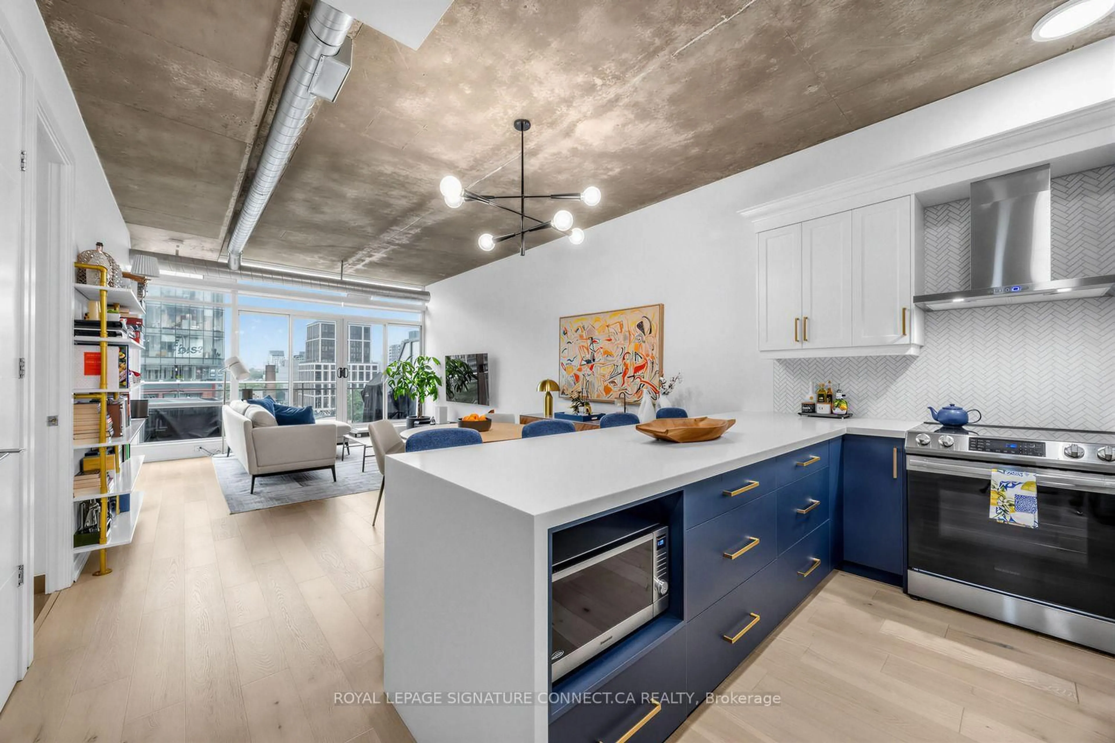 Open concept kitchen, cement floor for 66 Portland St #PH806, Toronto Ontario M5V 2M6