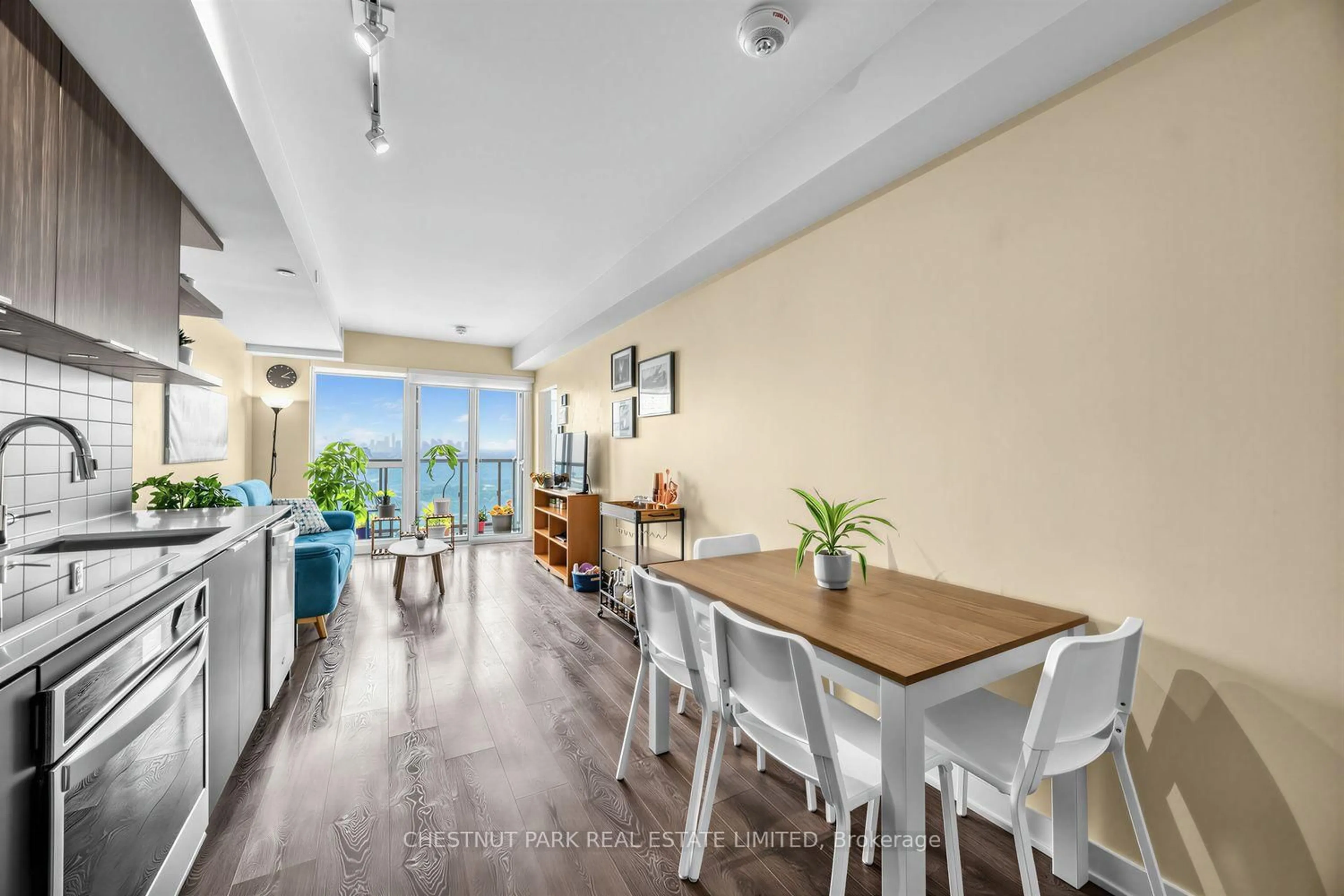 Dining room, wood/laminate floor for 6 Sonic Way #2401, Toronto Ontario M3C 0P1