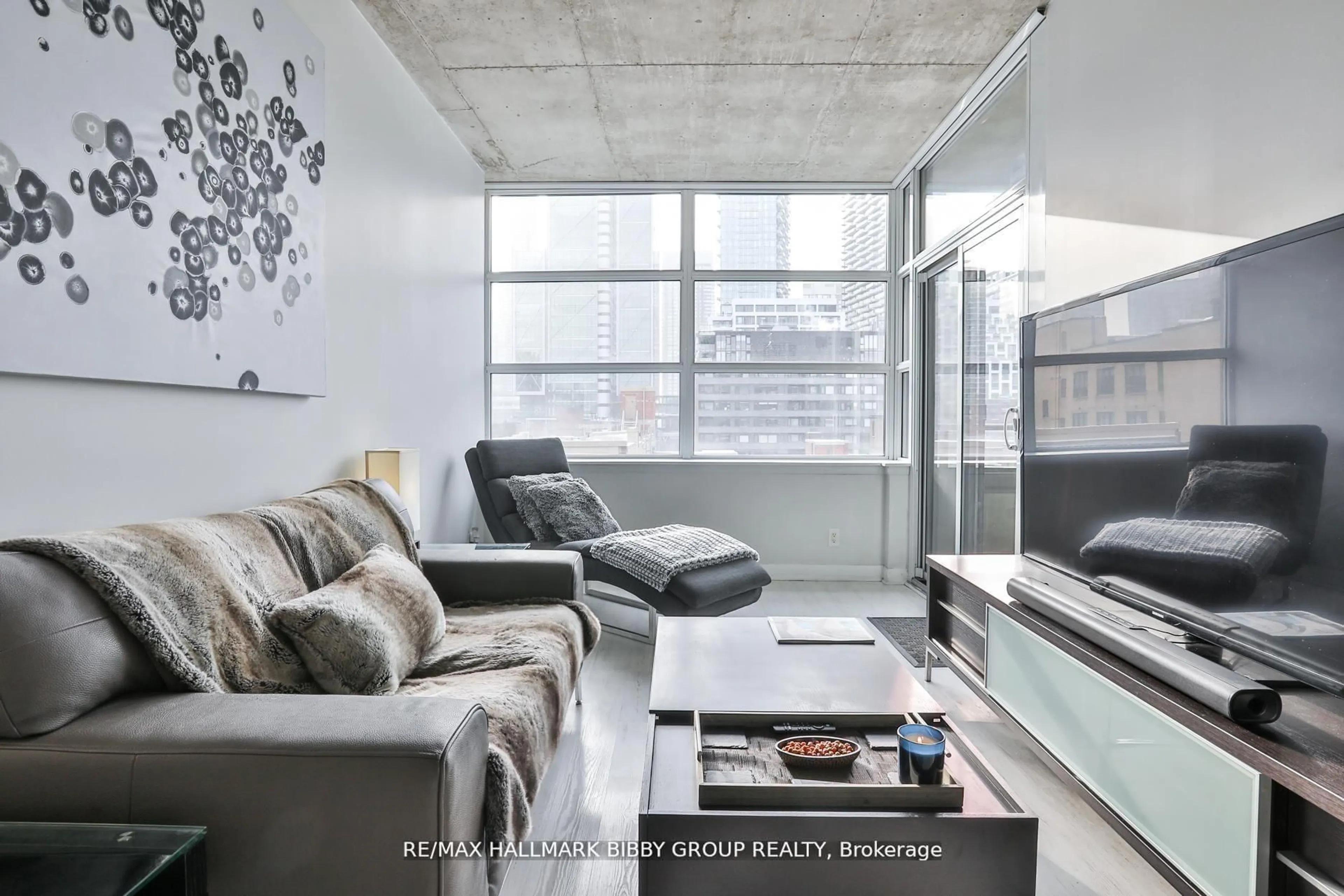 Living room with furniture, cement floor for 478 King St #606, Toronto Ontario M5V 0A8