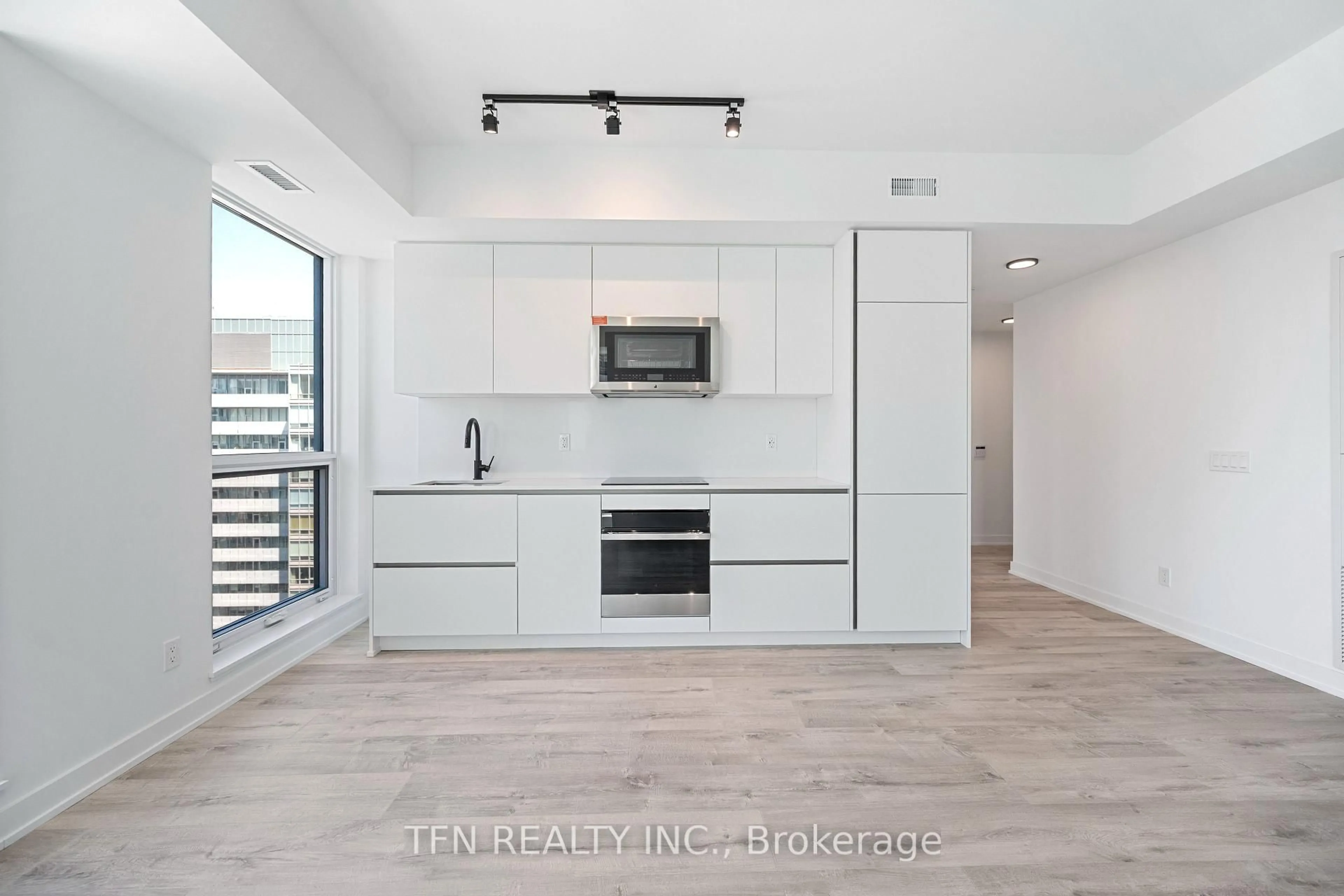 Open concept kitchen, wood/laminate floor for 327 King St #4505, Toronto Ontario M5A 0Y5
