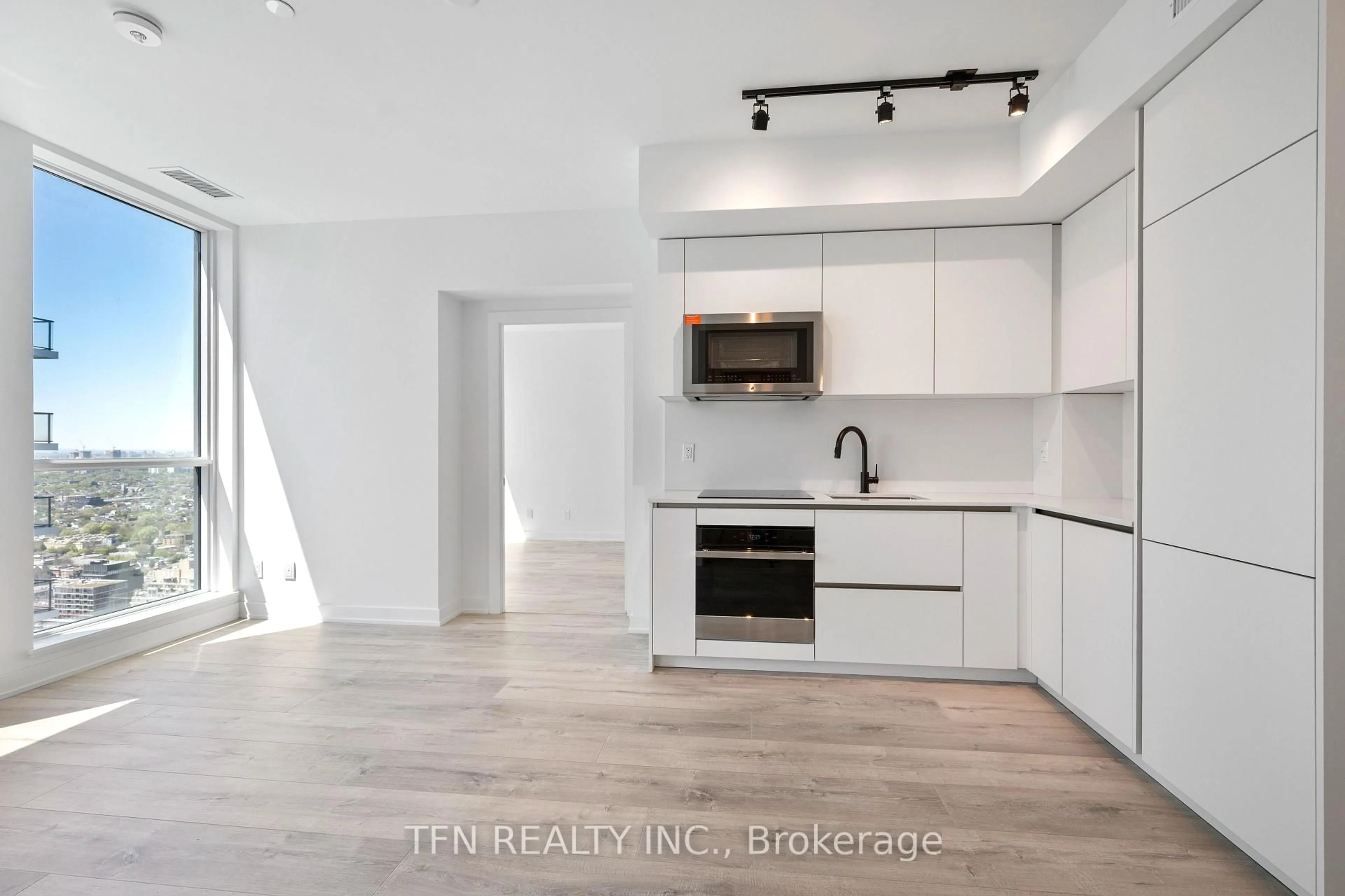 Open concept kitchen, unknown for 327 King St #4704, Toronto Ontario M5A 0Y5