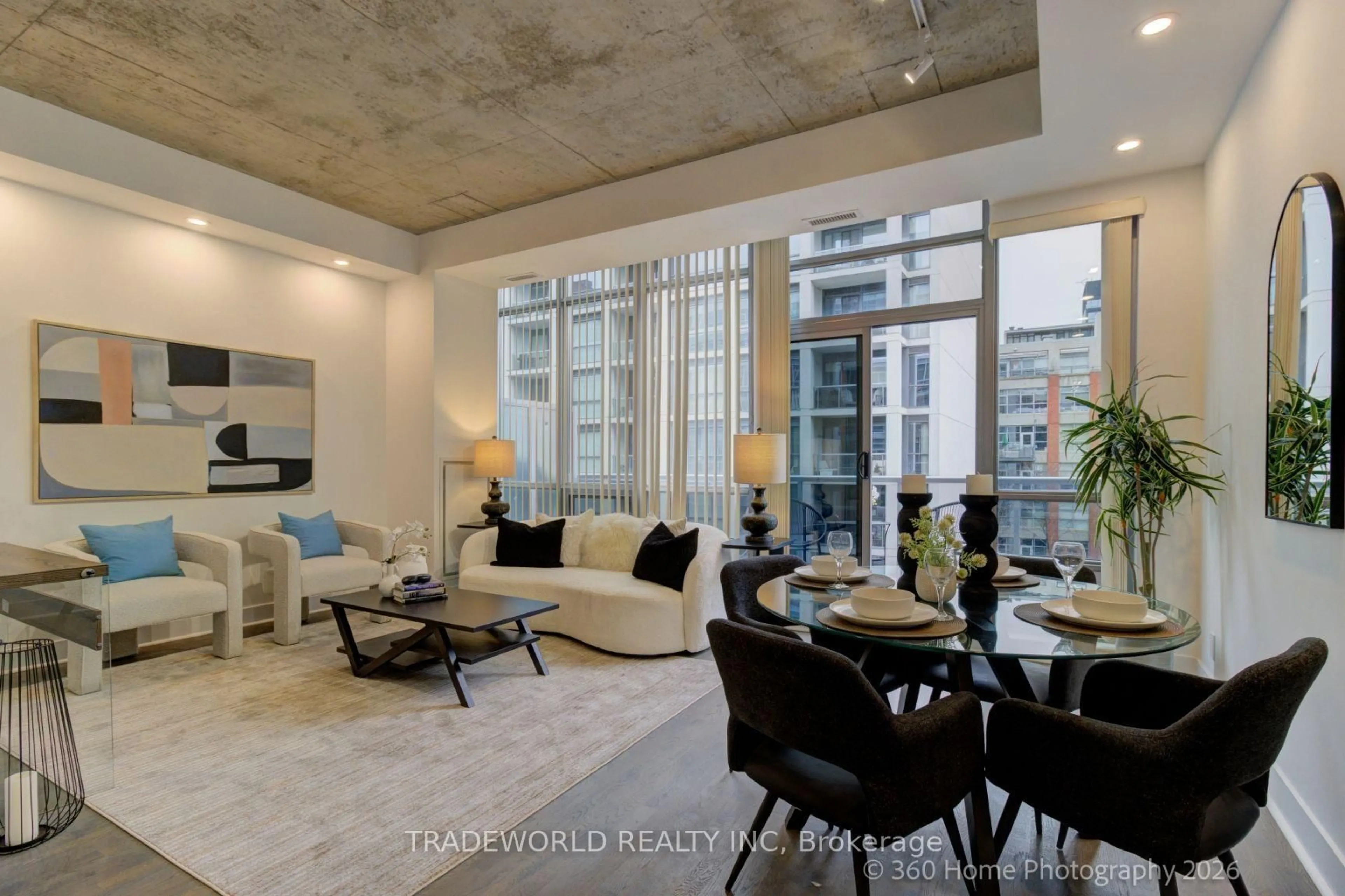 Living room with furniture, cement floor for 399 Adelaide St #603, Toronto Ontario M5V 1S4