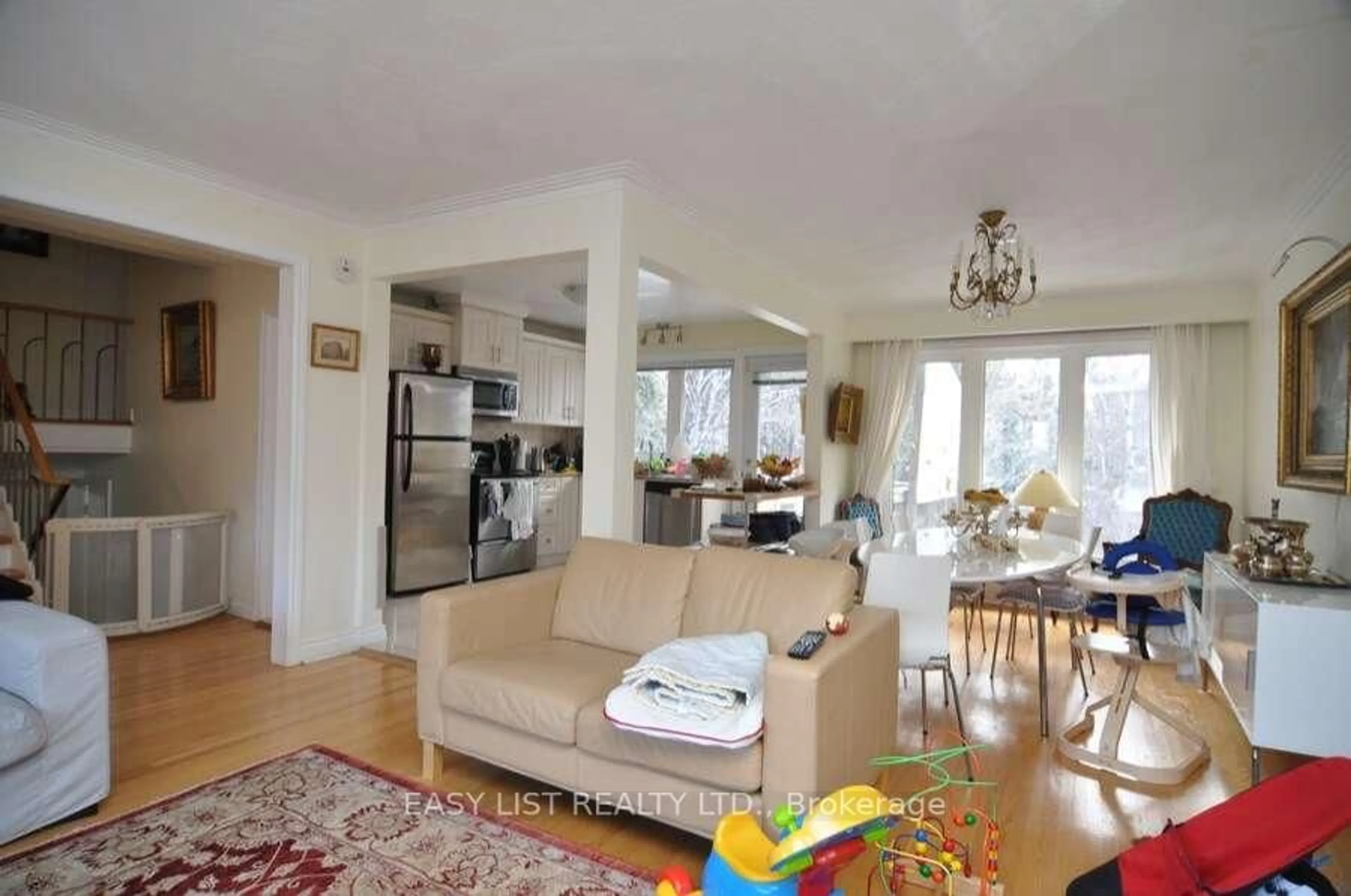 Living room with furniture, wood/laminate floor for 43 Churchill Ave, Toronto Ontario M6J 2B5