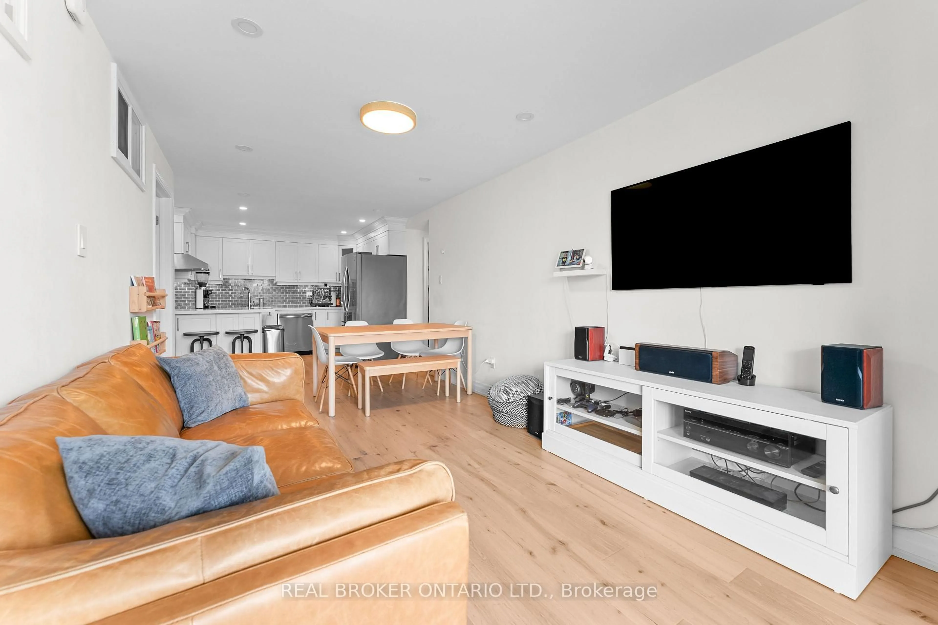 Living room with furniture, wood/laminate floor for 99 Cameron St #502, Toronto Ontario M5T 3A2