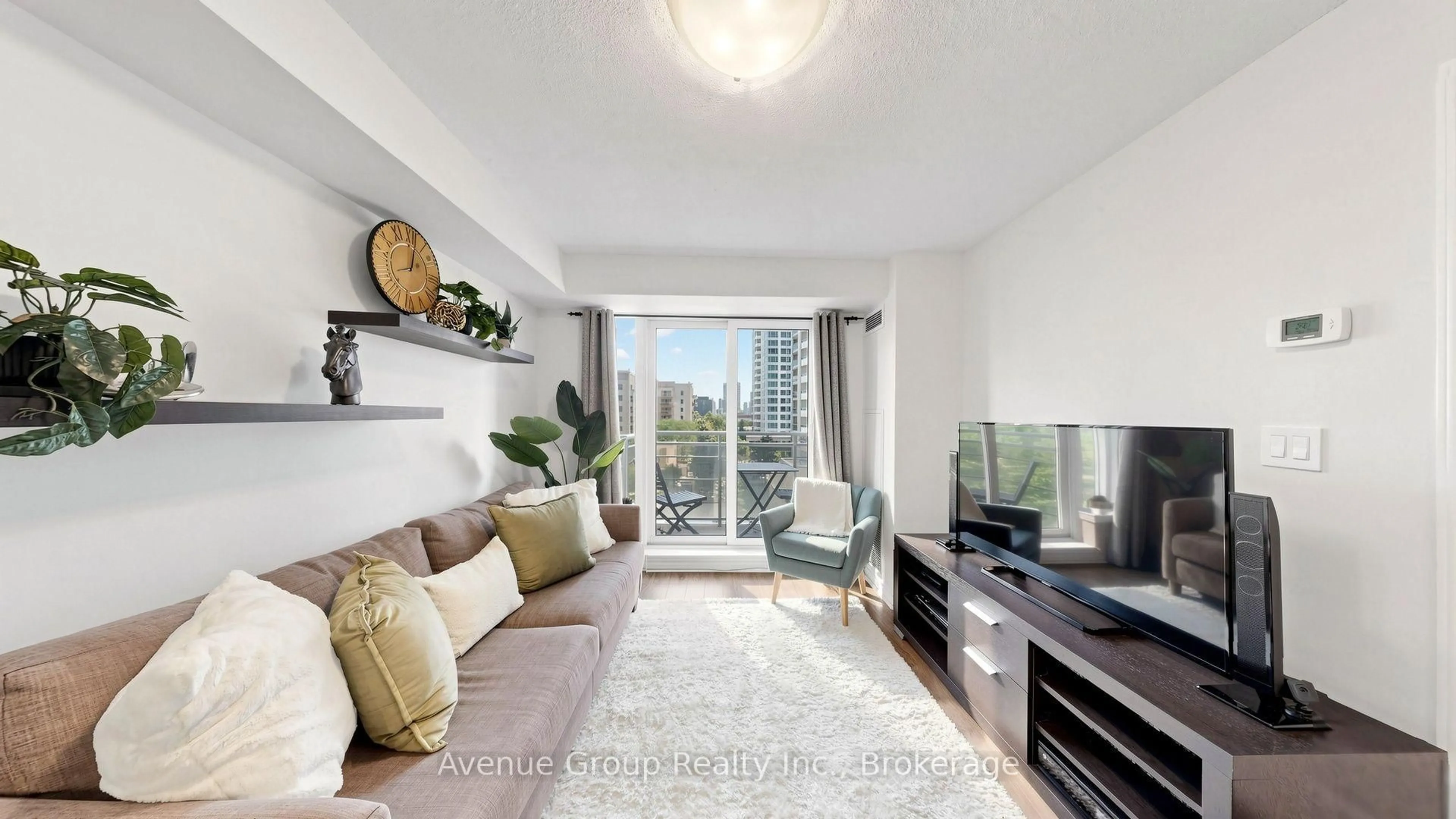 Living room with furniture, wood/laminate floor for 19 Barberry Pl #513, Toronto Ontario M2K 3E3