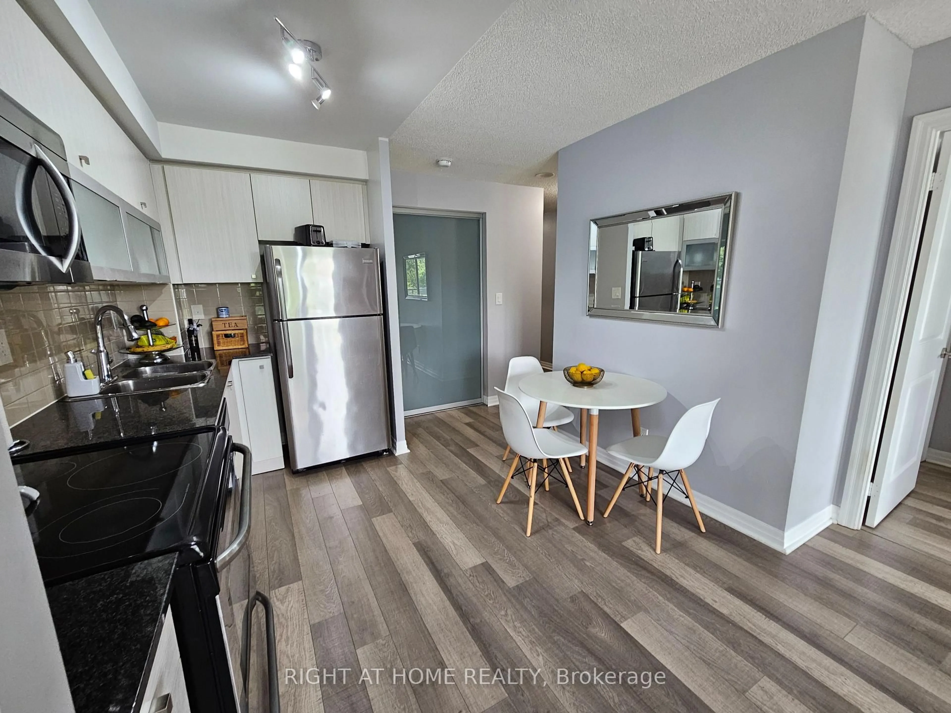 Open concept kitchen, wood/laminate floor for 2015 Sheppard Ave #307, Toronto Ontario M2J 0B3