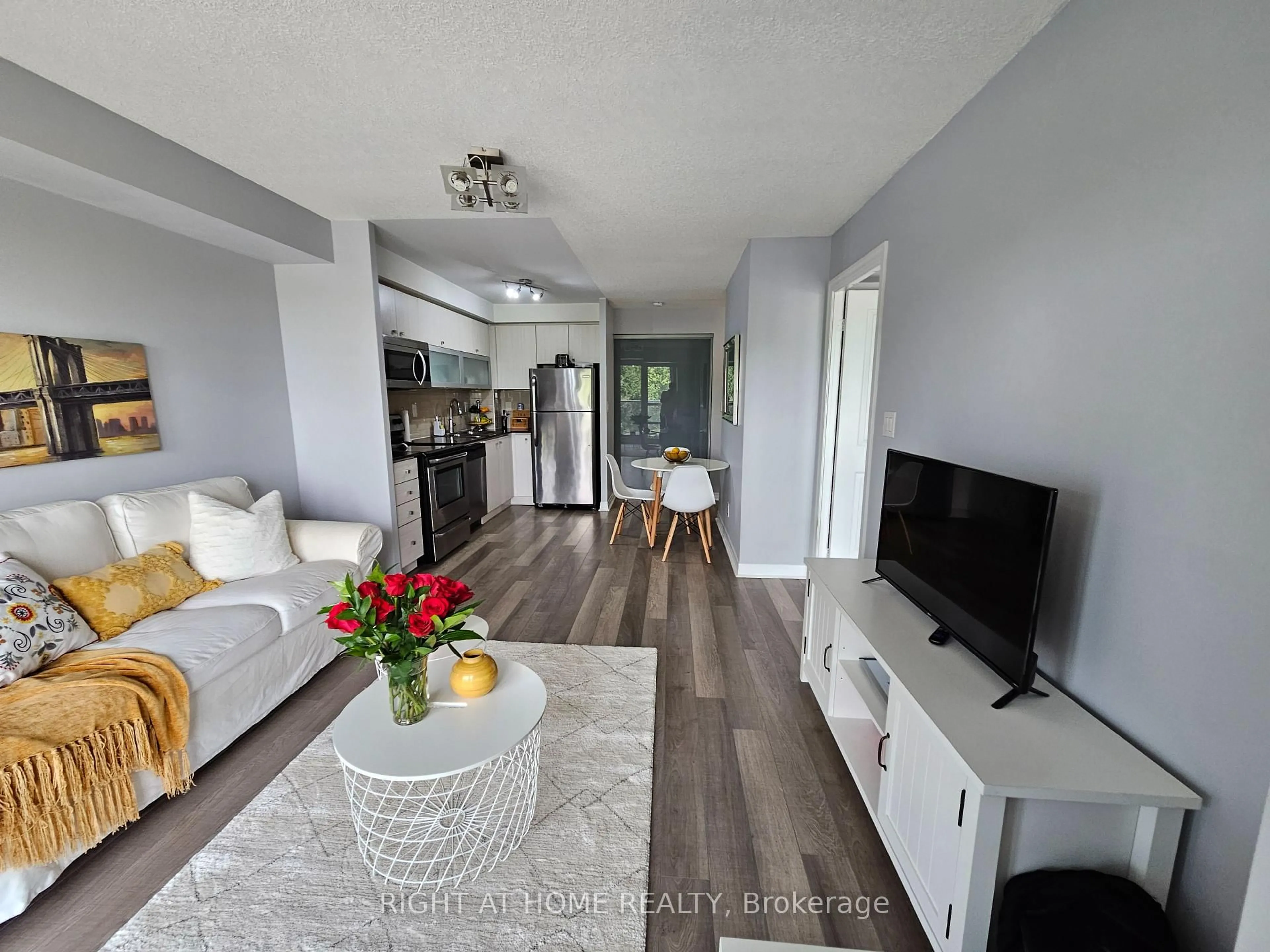 Living room with furniture, wood/laminate floor for 2015 Sheppard Ave #307, Toronto Ontario M2J 0B3