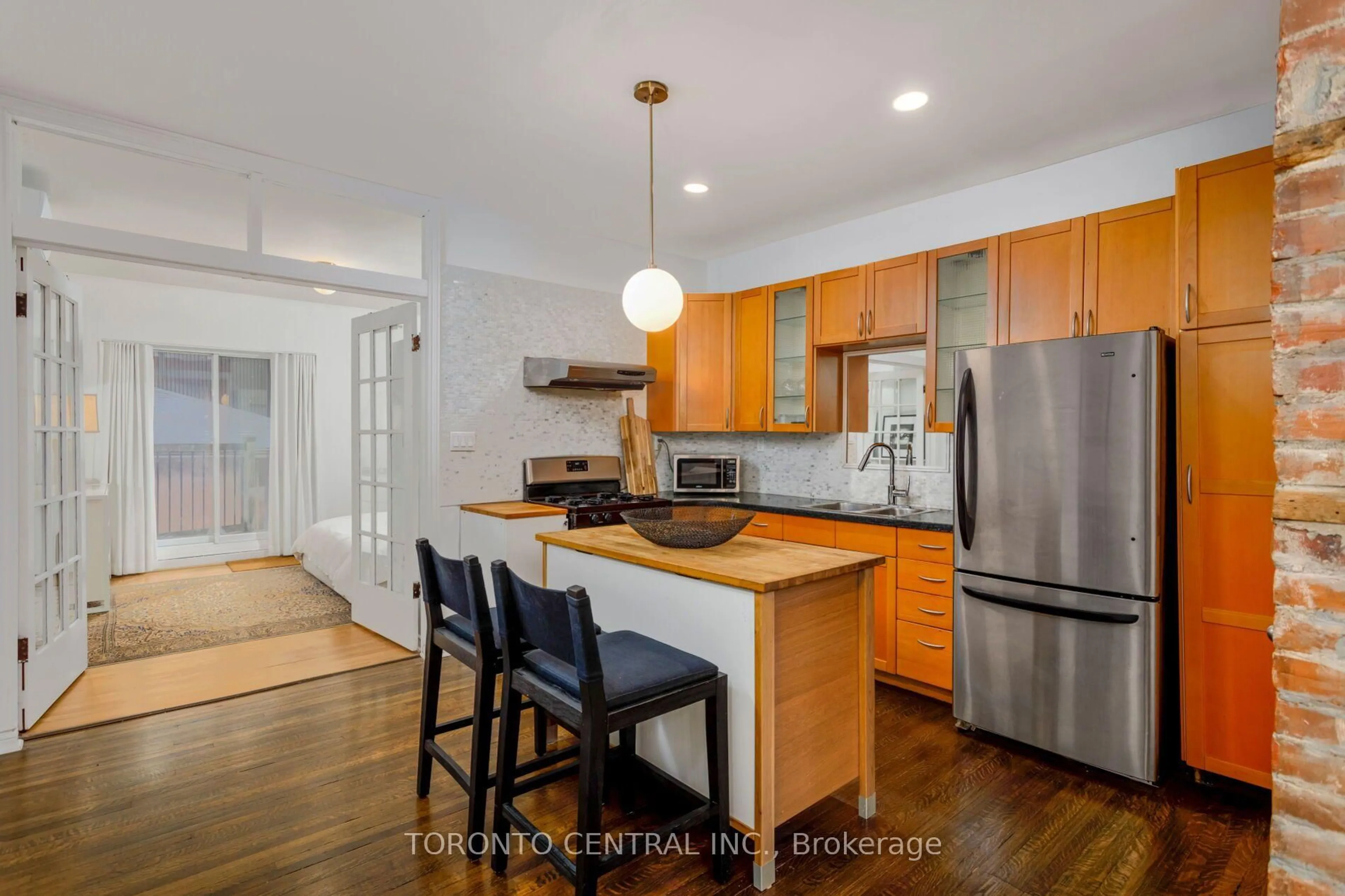 Open concept kitchen, wood/laminate floor for 24 Manning Ave, Toronto Ontario M6J 2K4