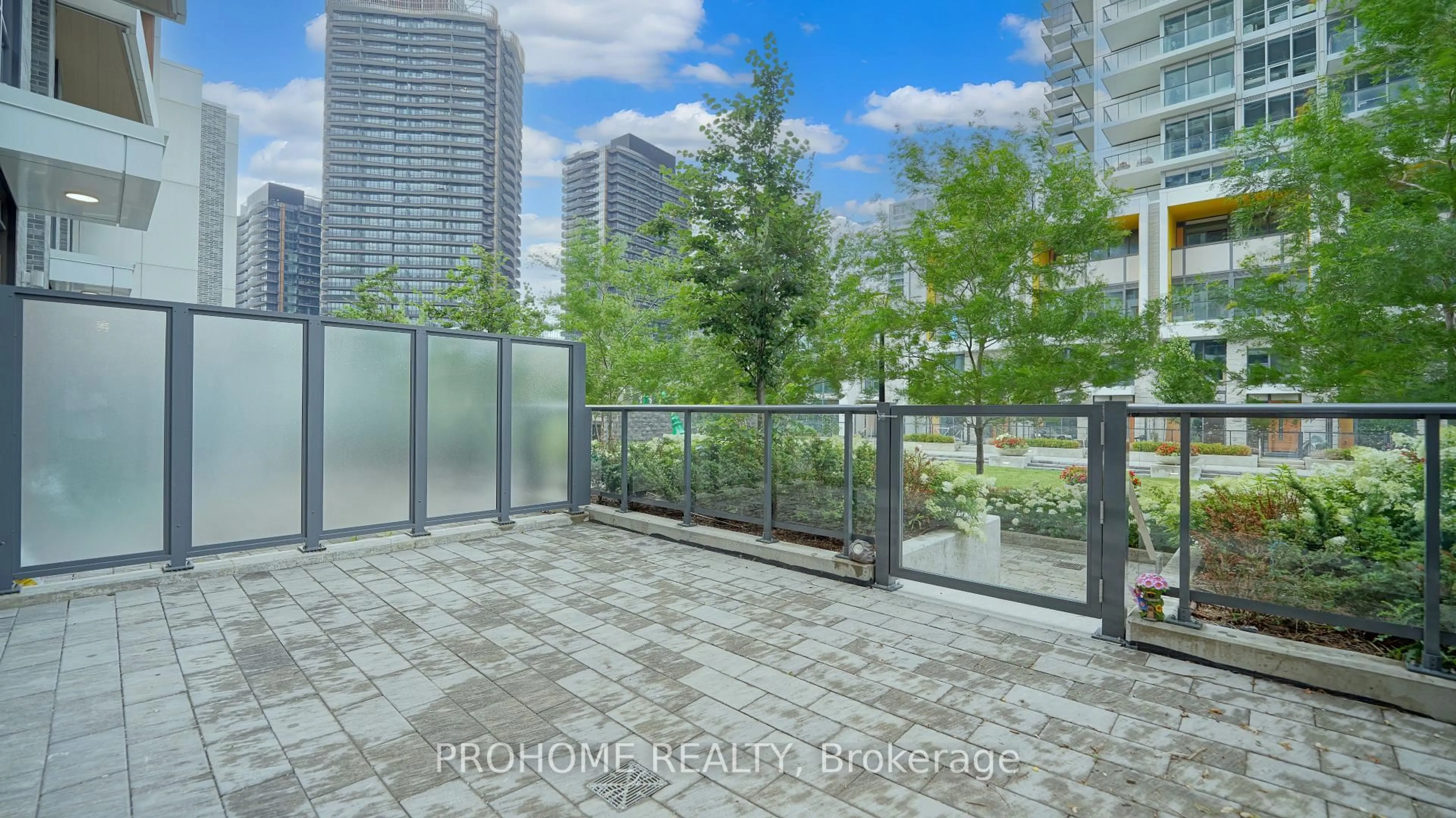 Patio, city buildings view from balcony for 27 McMahon Dr #111, Toronto Ontario M2K 0J2