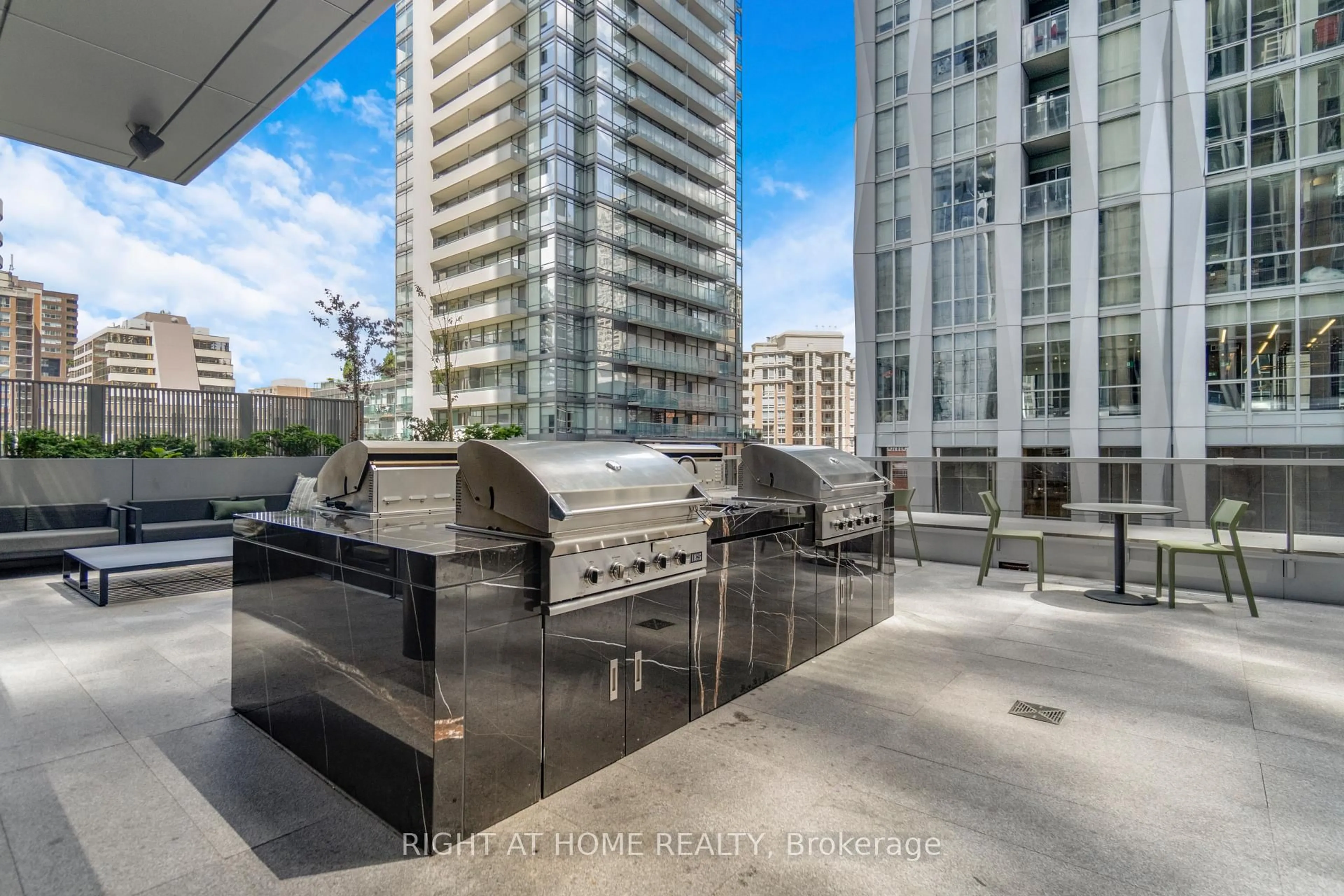 Patio, city buildings view from balcony for 11 Yorkville Ave #2113, Toronto Ontario M4W 0B7