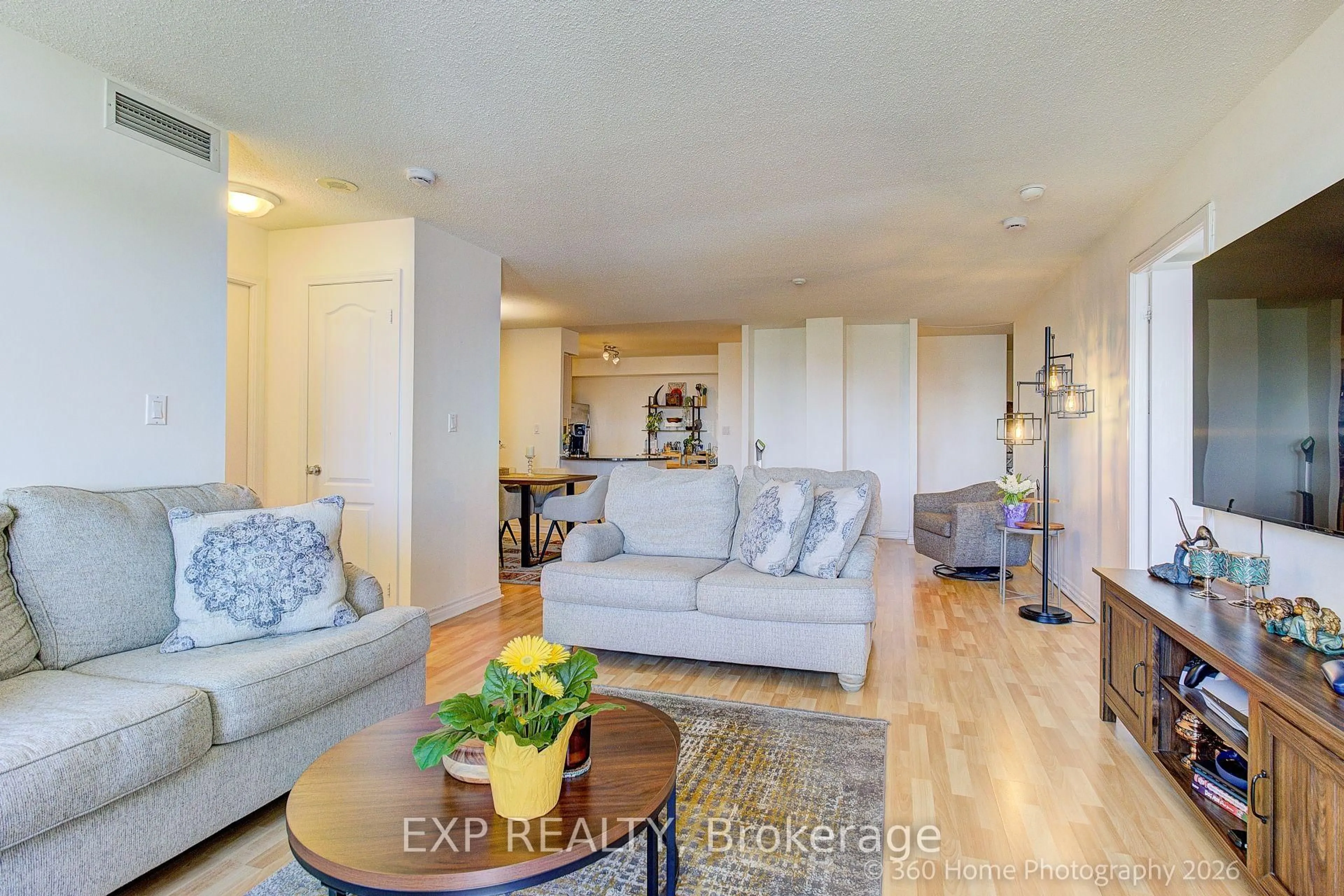 Living room with furniture, wood/laminate floor for 8 Rean Dr #1705, Toronto Ontario M2K 3B9