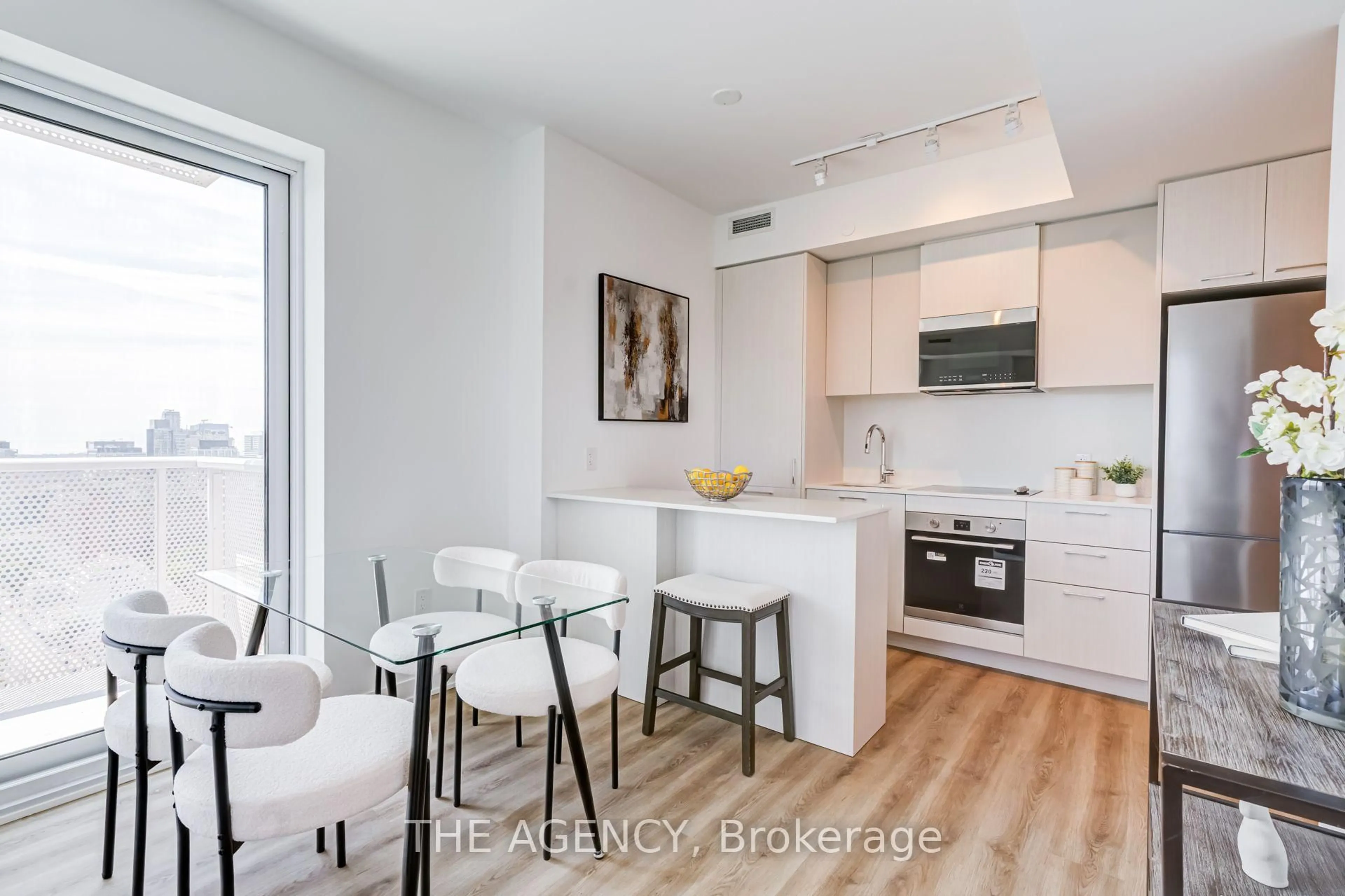Open concept kitchen, wood/laminate floor for 10 Oak St #2403, Toronto Ontario M5A 0Z1