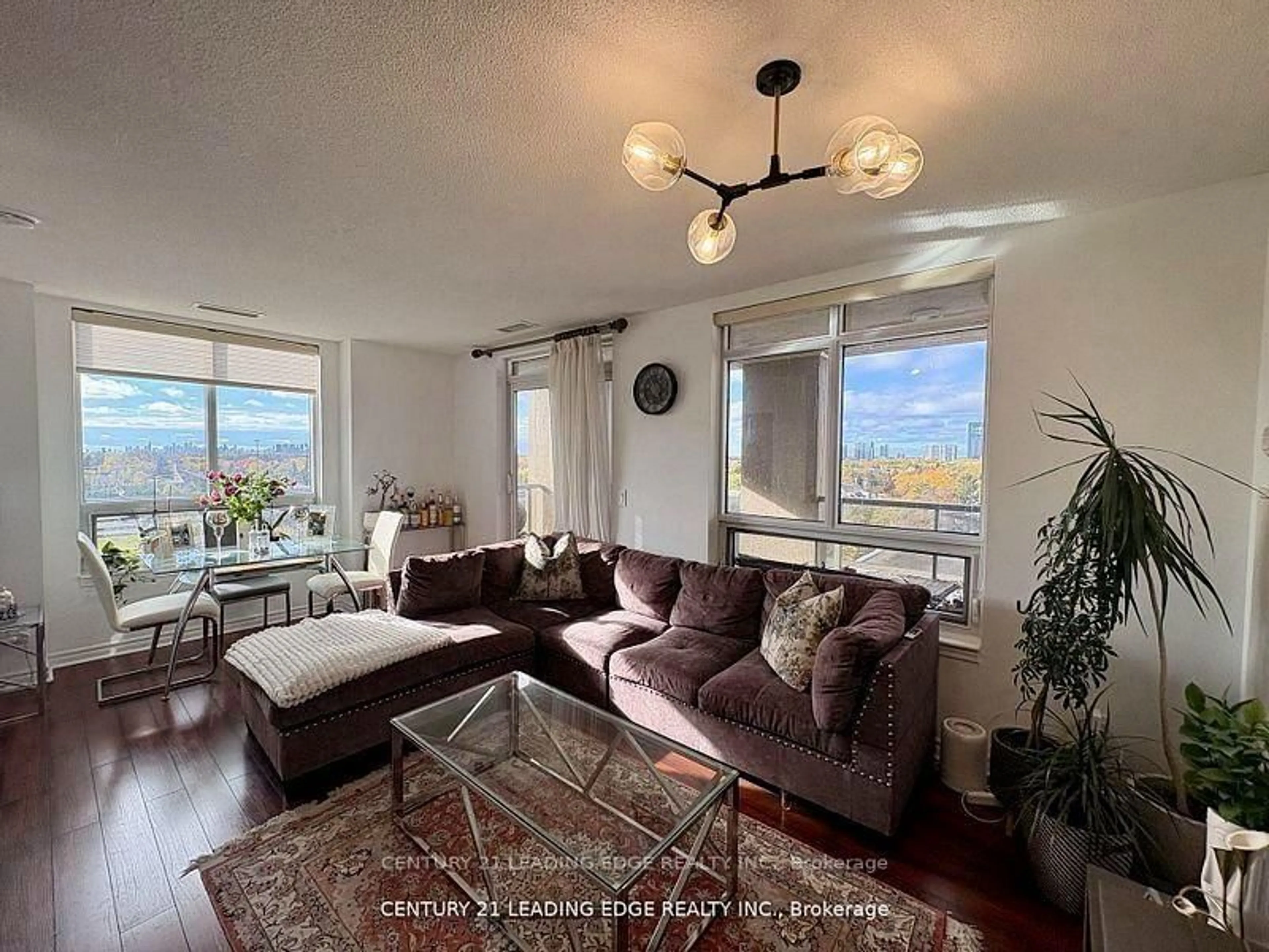 Living room with furniture, wood/laminate floor for 18 Kenaston Gdns #712, Toronto Ontario M2K 3C7