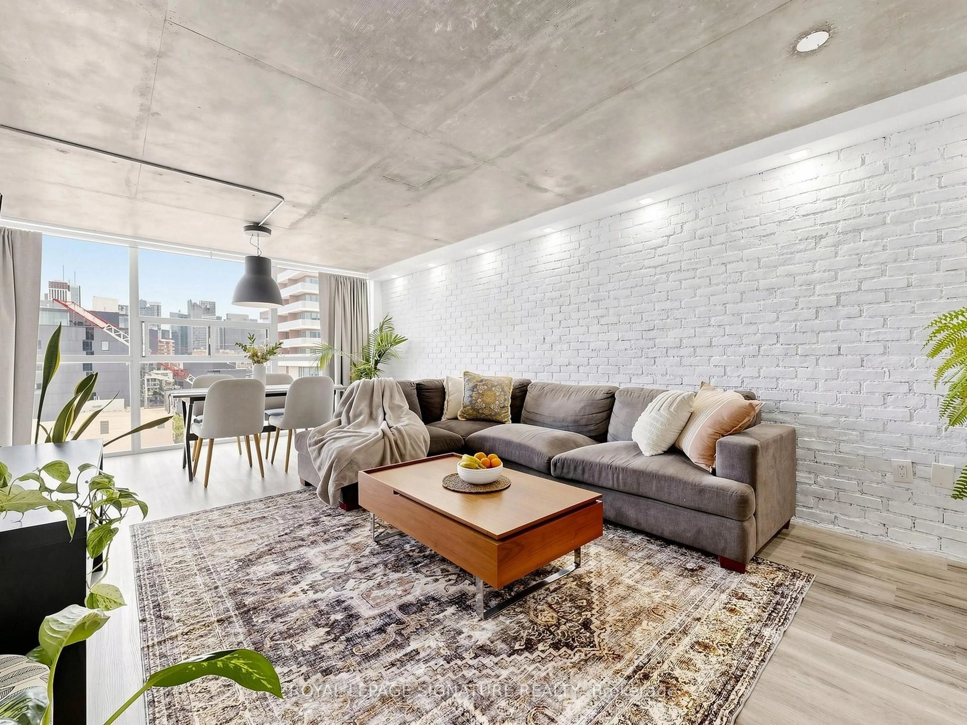 Living room with furniture, cement floor for 705 King St #1603, Toronto Ontario M5V 2W8