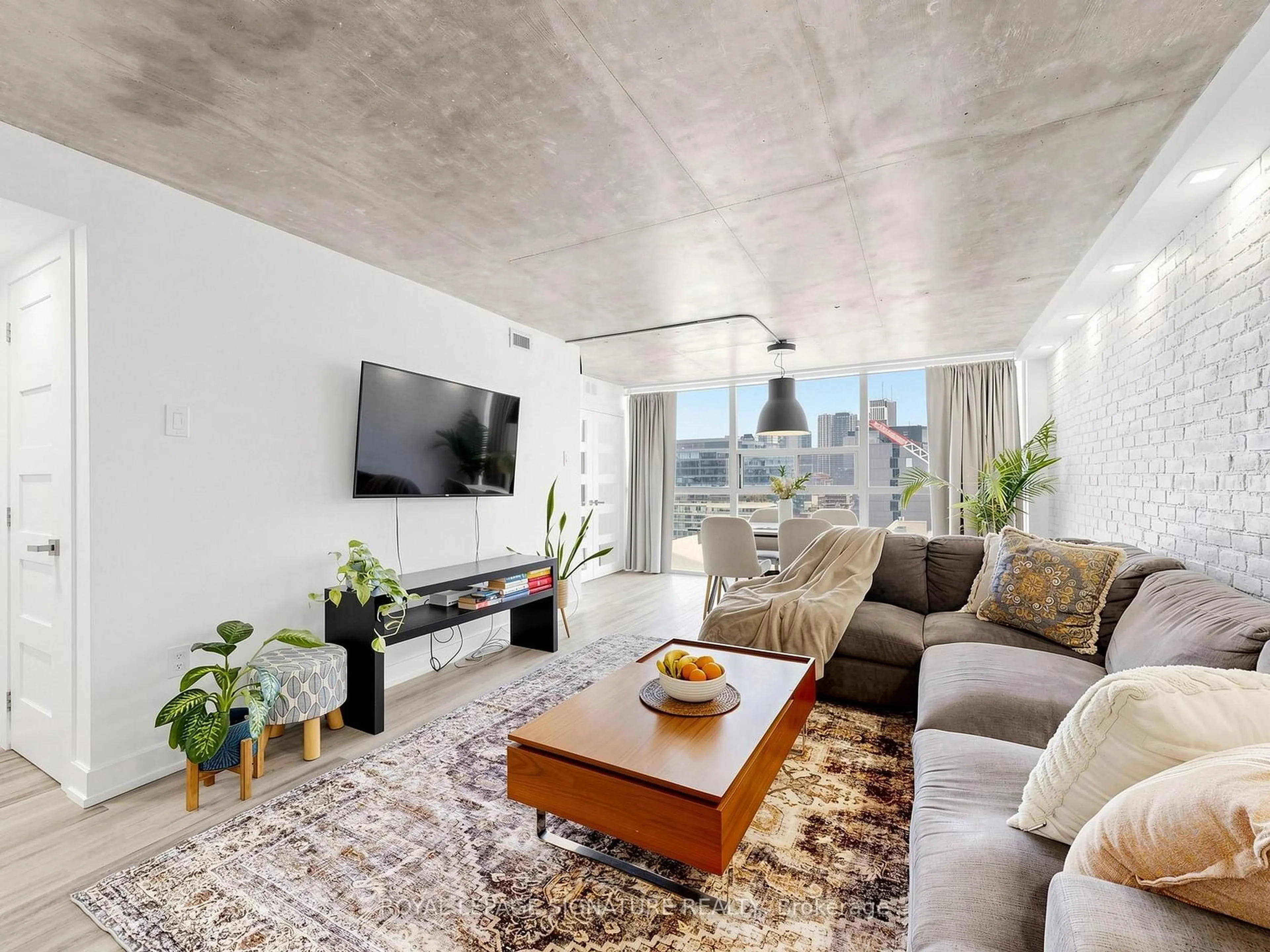 Living room with furniture, cement floor for 705 King St #1603, Toronto Ontario M5V 2W8