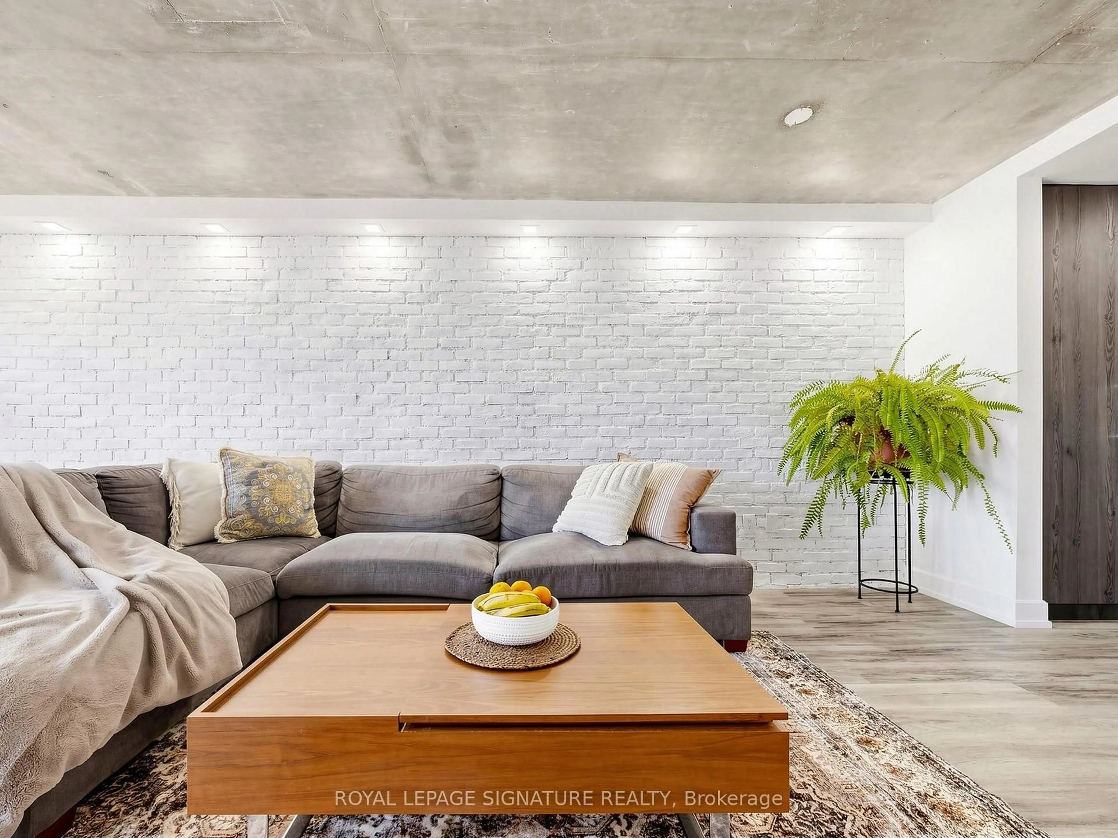 Living room with furniture, cement floor for 705 King St #1603, Toronto Ontario M5V 2W8
