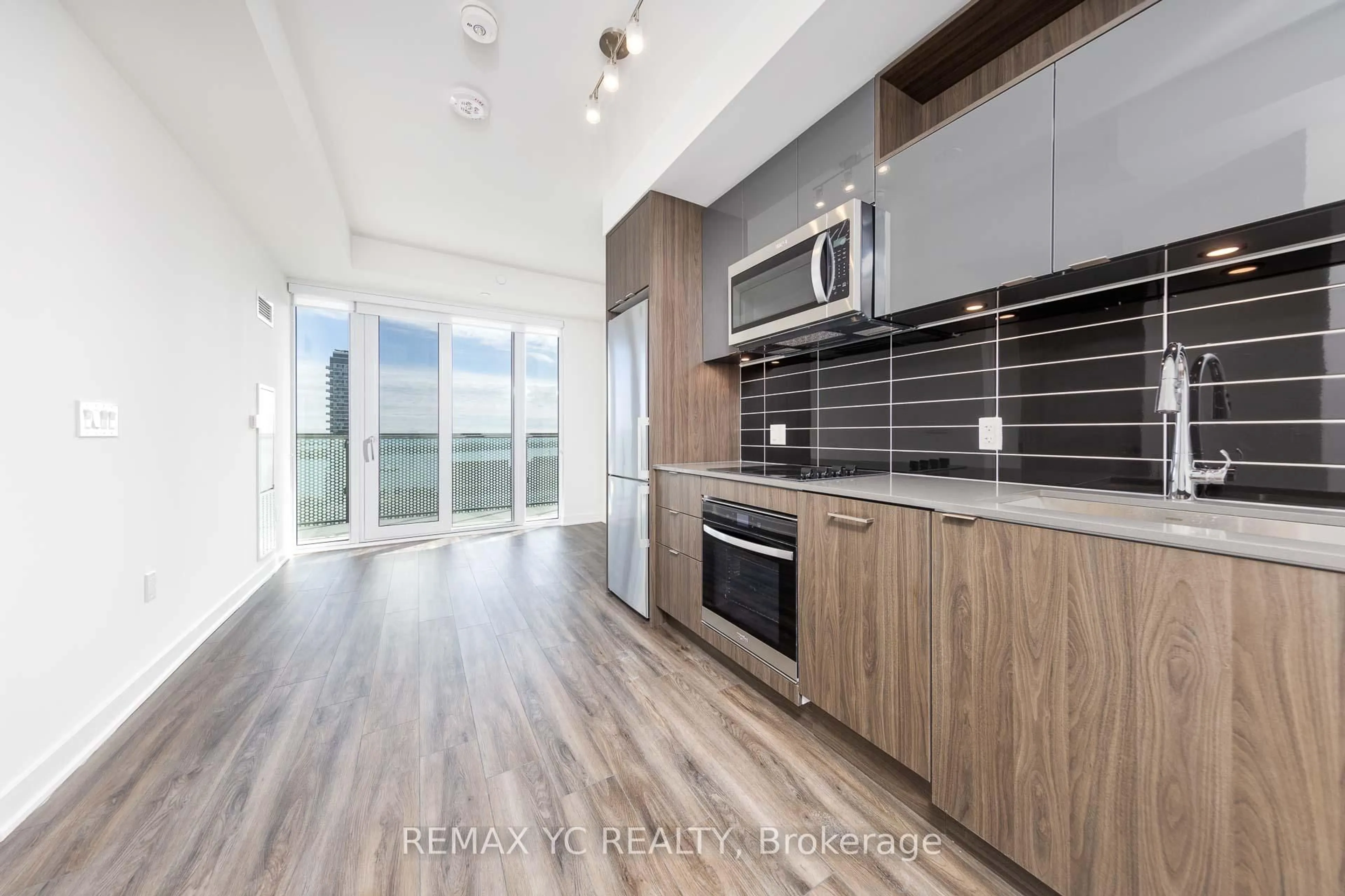 Open concept kitchen, wood/laminate floor for 135 Lower Sherbourne St #2726, Toronto Ontario M5A 1Y4