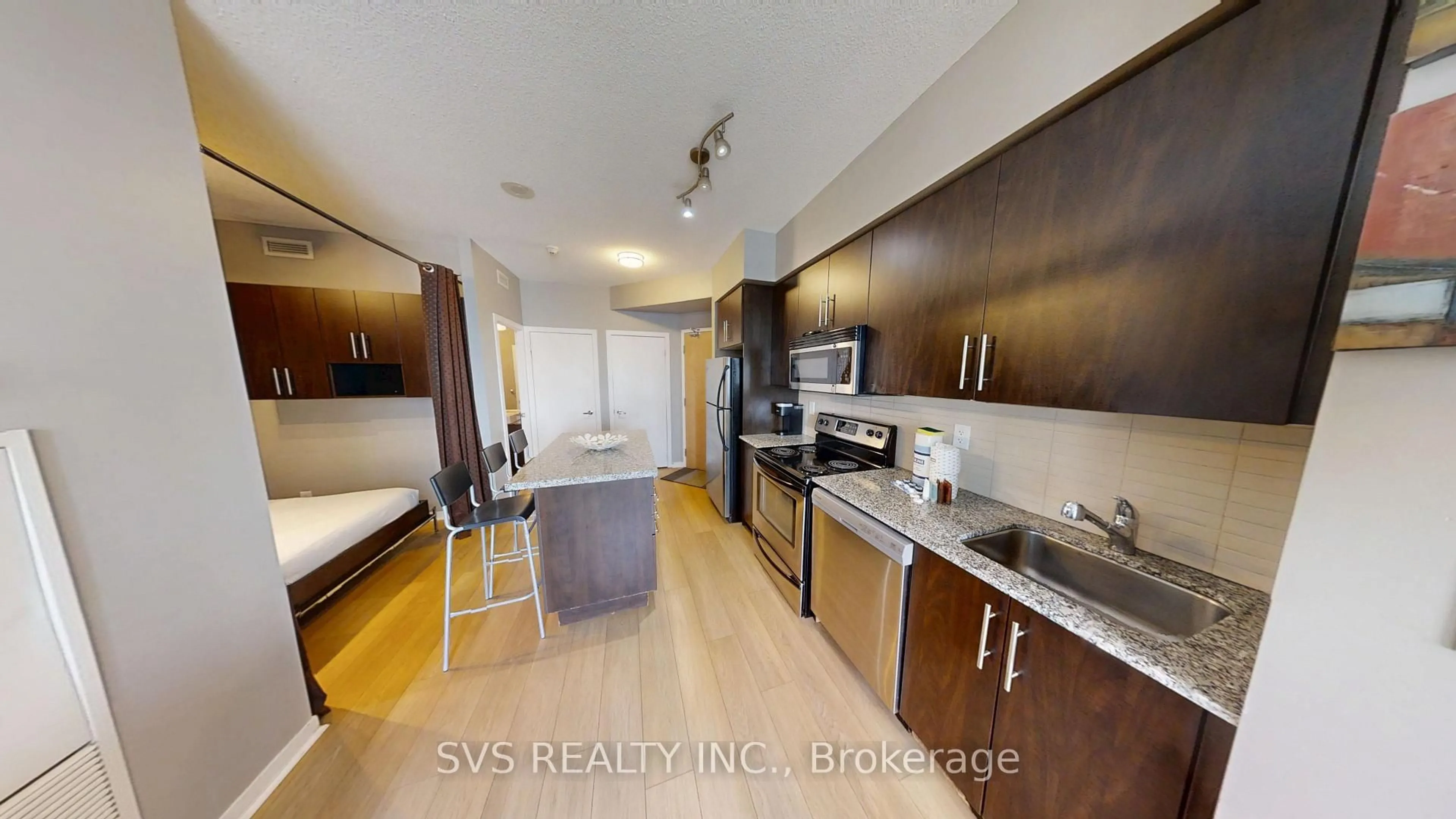 Open concept kitchen, wood/laminate floor for 55 Bremner Blvd #1705, Toronto Ontario M5J 0A6