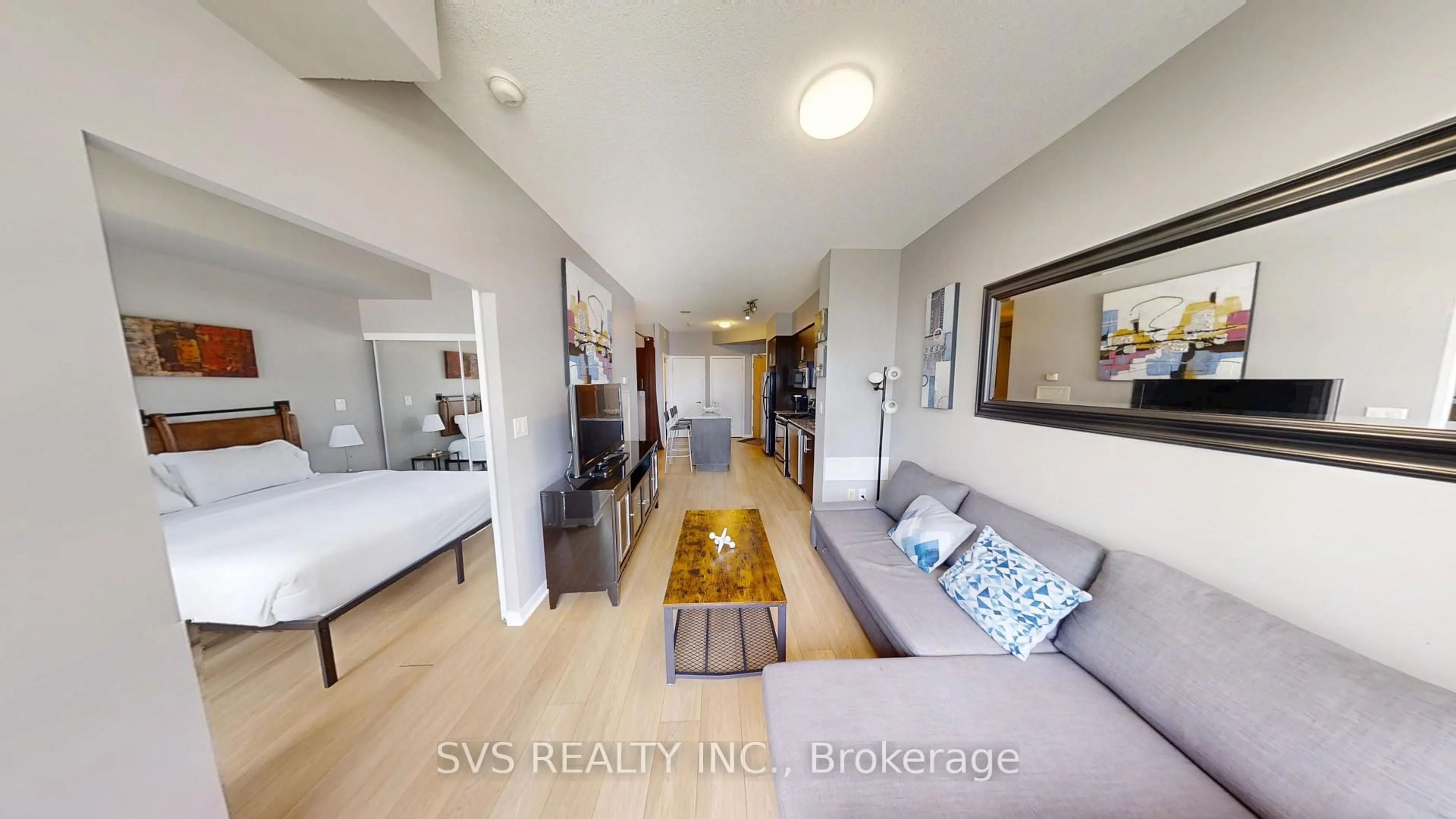 Living room with furniture, wood/laminate floor for 55 Bremner Blvd #1705, Toronto Ontario M5J 0A6