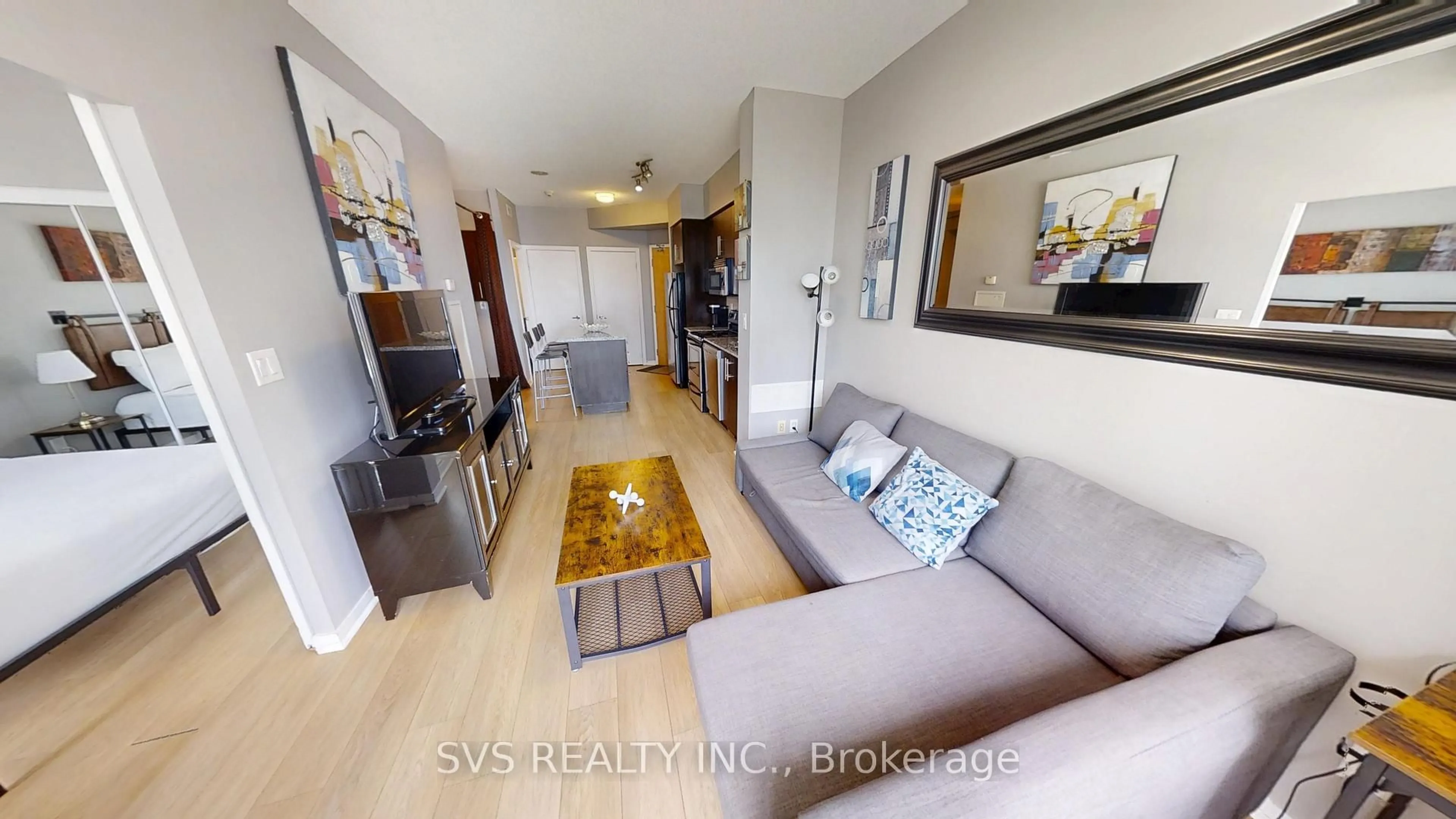 Living room with furniture, unknown for 55 Bremner Blvd #1705, Toronto Ontario M5J 0A6