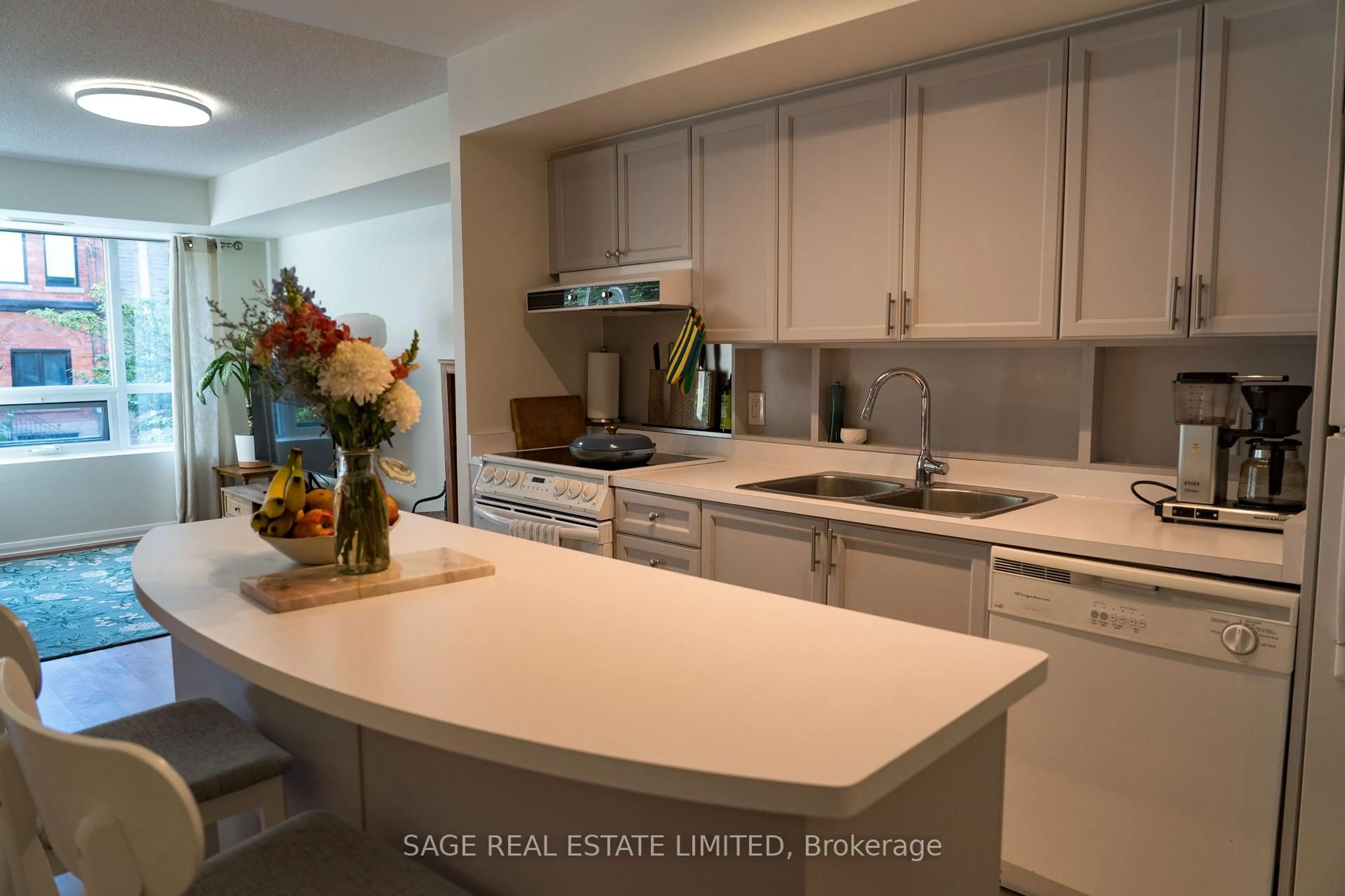 Open concept kitchen, wood/laminate floor for 18 Beverley St #209, Toronto Ontario M5T 3L2