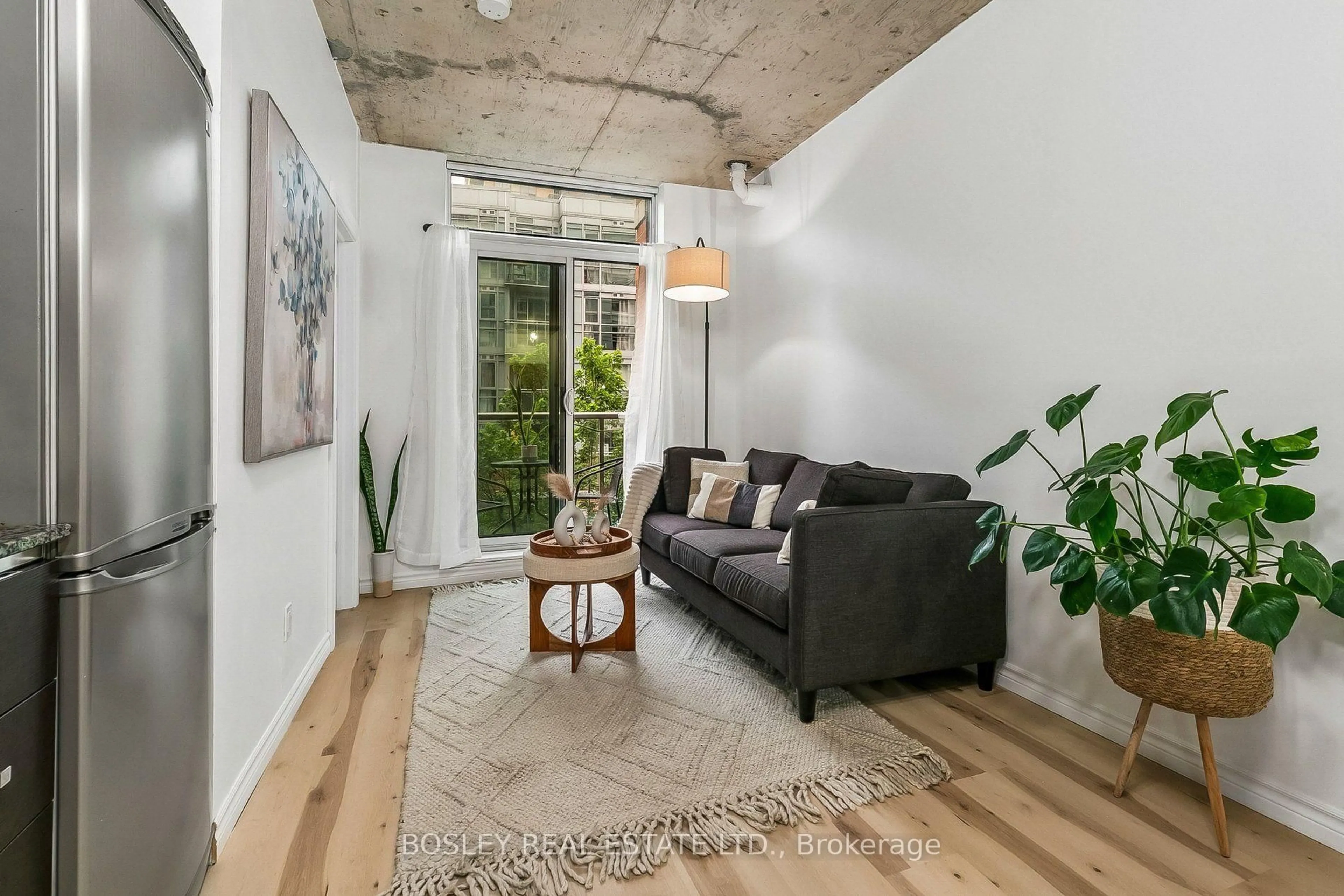 Living room with furniture, cement floor for 150 Sudbury St #506, Toronto Ontario M6J 3S8