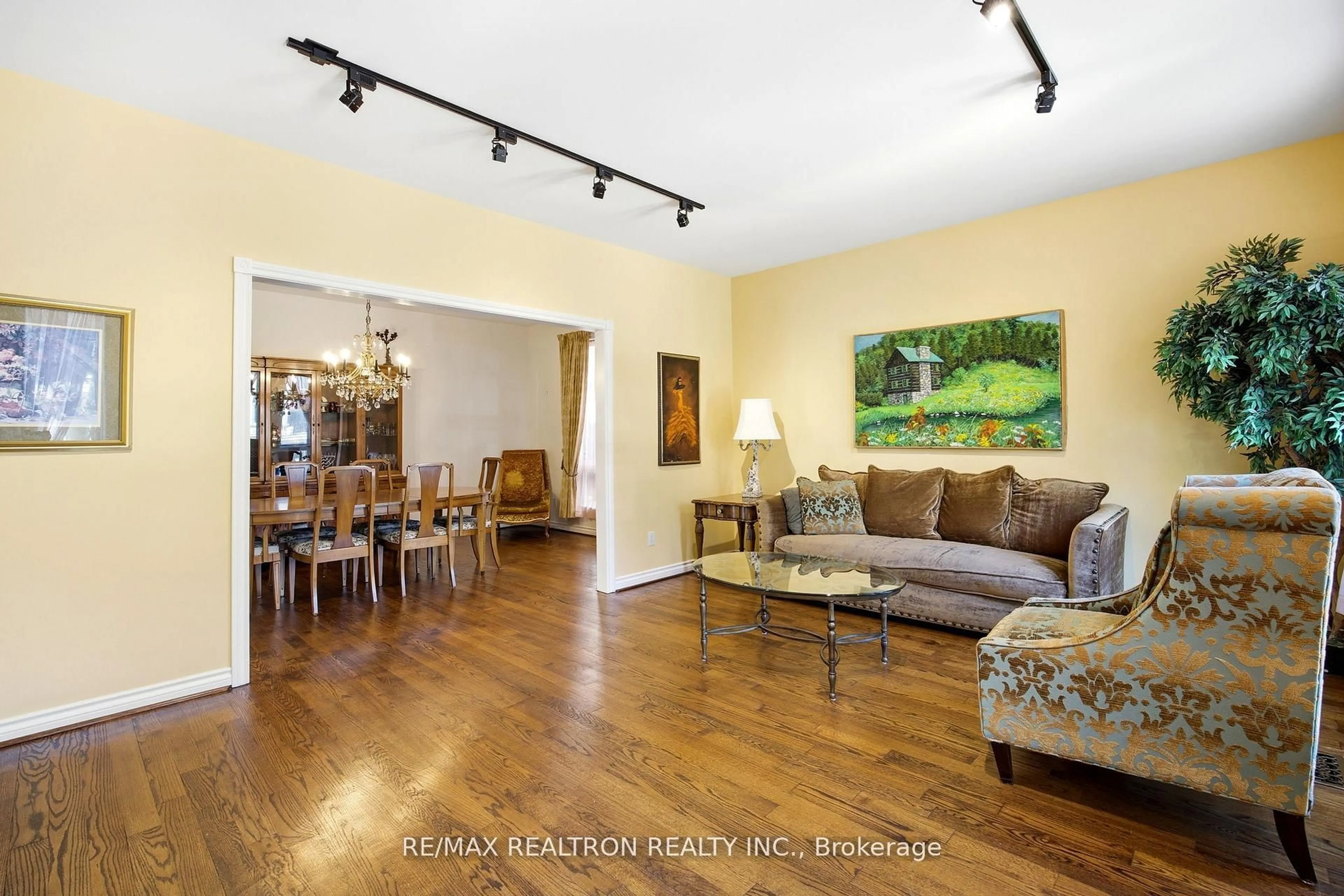 Living room with furniture, wood/laminate floor for 623 Coldstream Ave, Toronto Ontario M6B 2L1