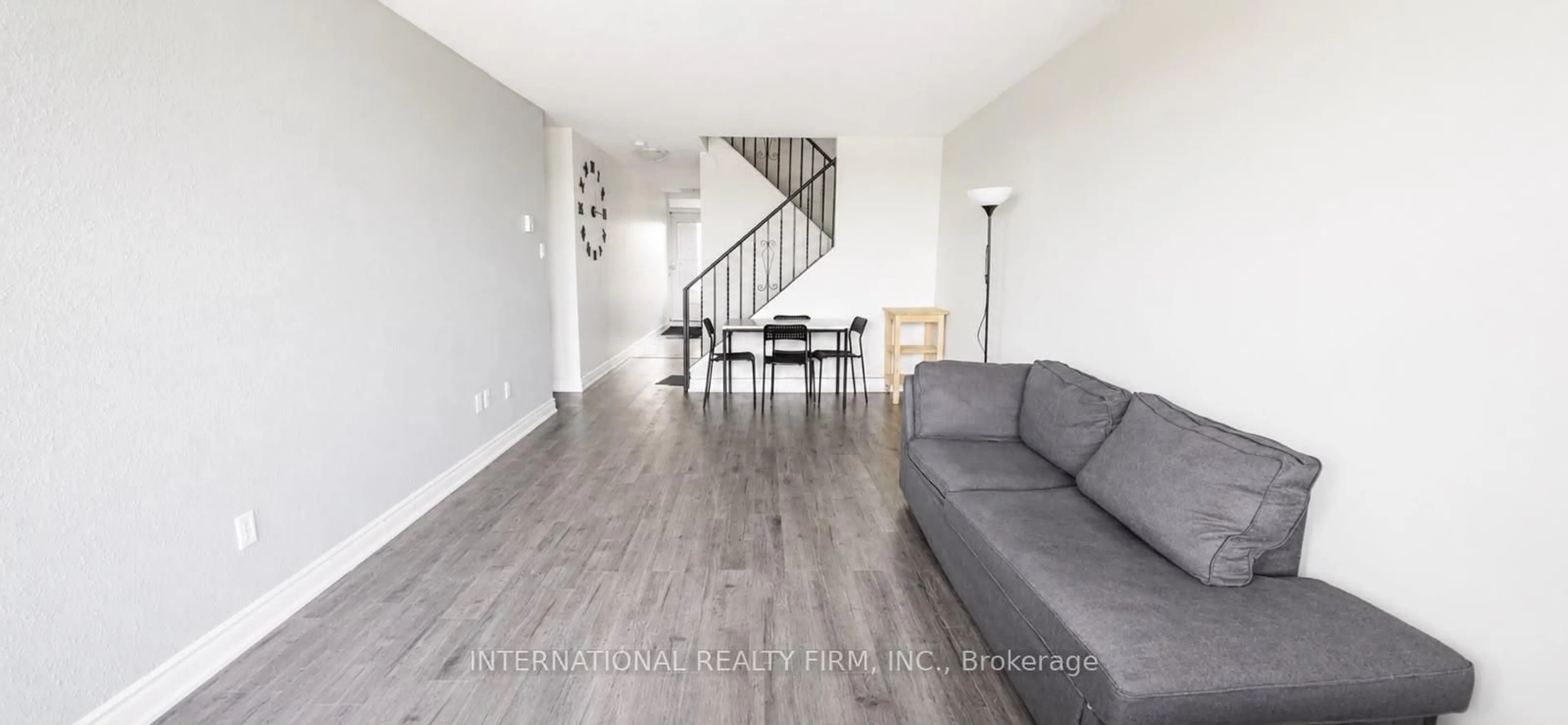 Living room with furniture, wood/laminate floor for 40 Sunny Glwy #308, Toronto Ontario M3C 2Z2