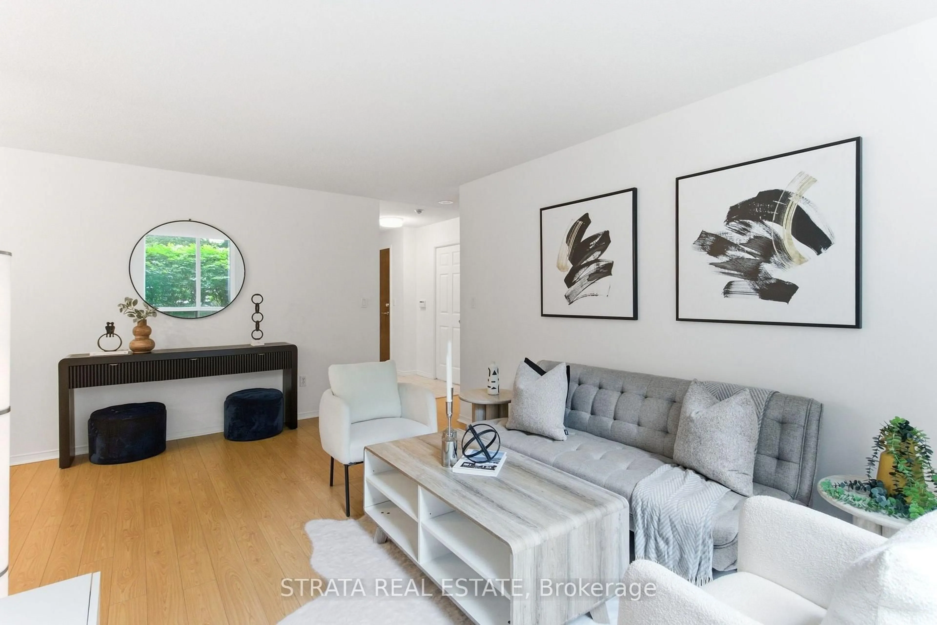 Living room with furniture, wood/laminate floor for 29 Pemberton Ave #105, Toronto Ontario M2M 4L5
