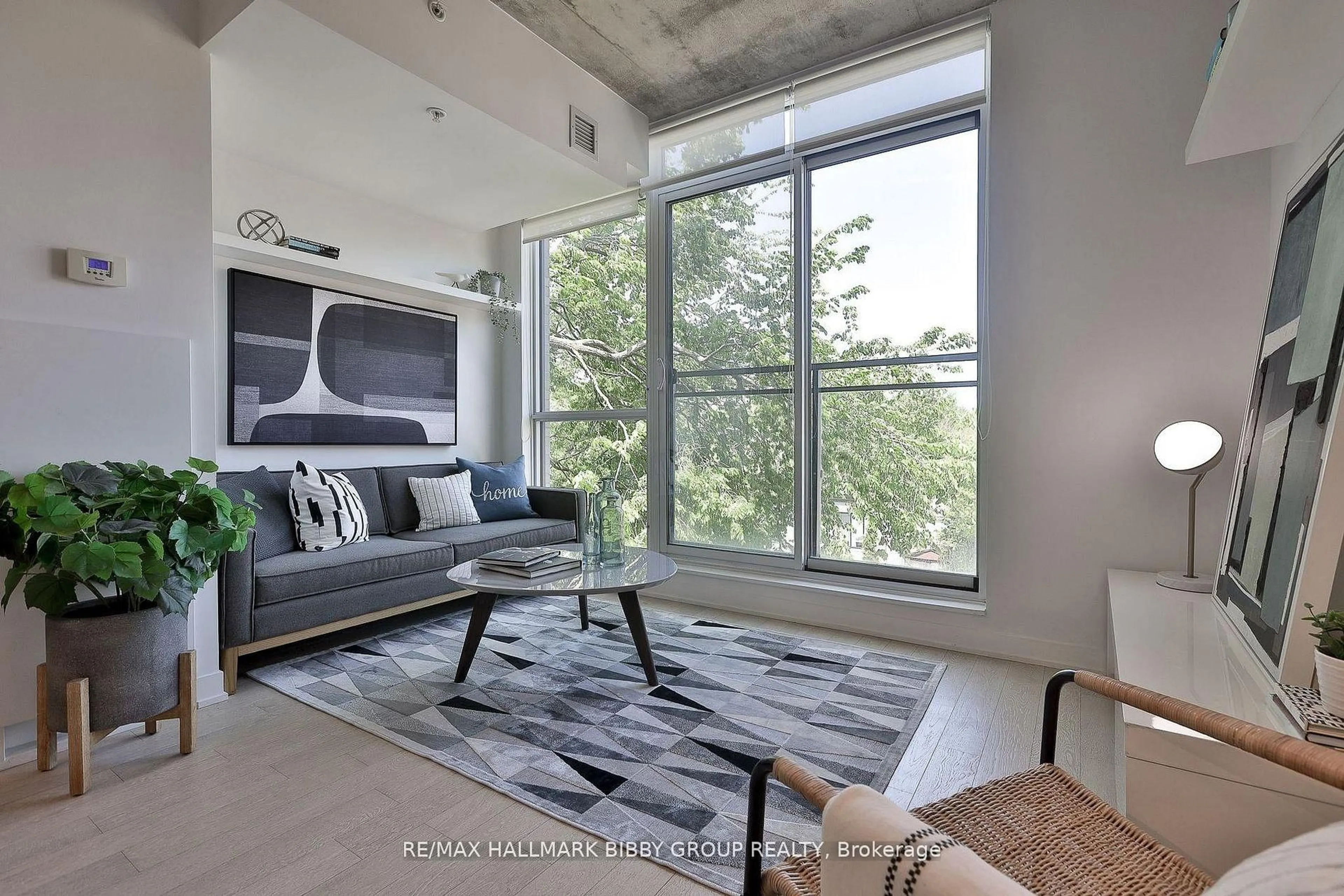 Living room with furniture, unknown for 130 Rusholme Rd #309, Toronto Ontario M6H 1A7